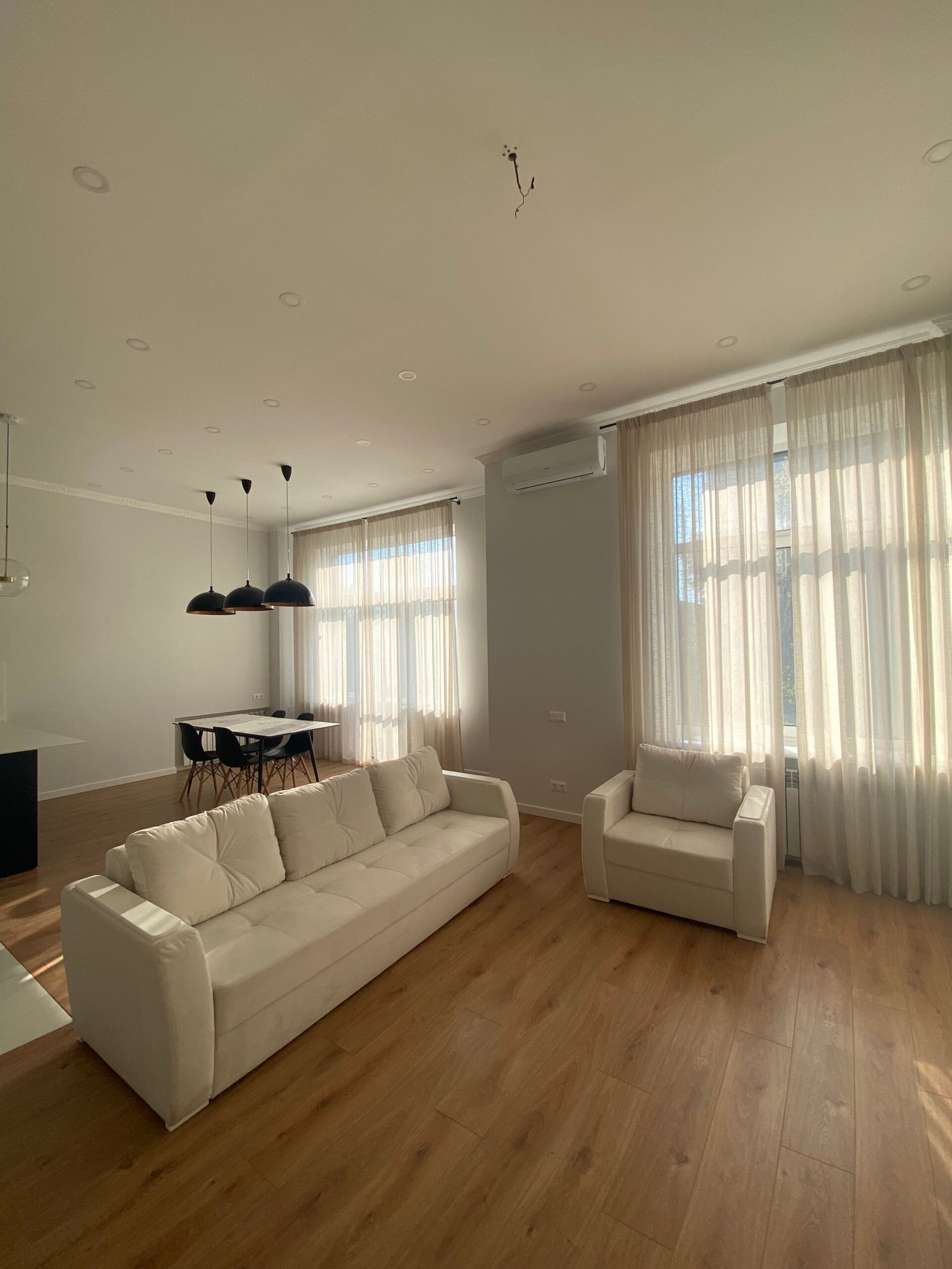 Living area with sofa, armchair, and dining table, Kyiv — Vestor.Estate