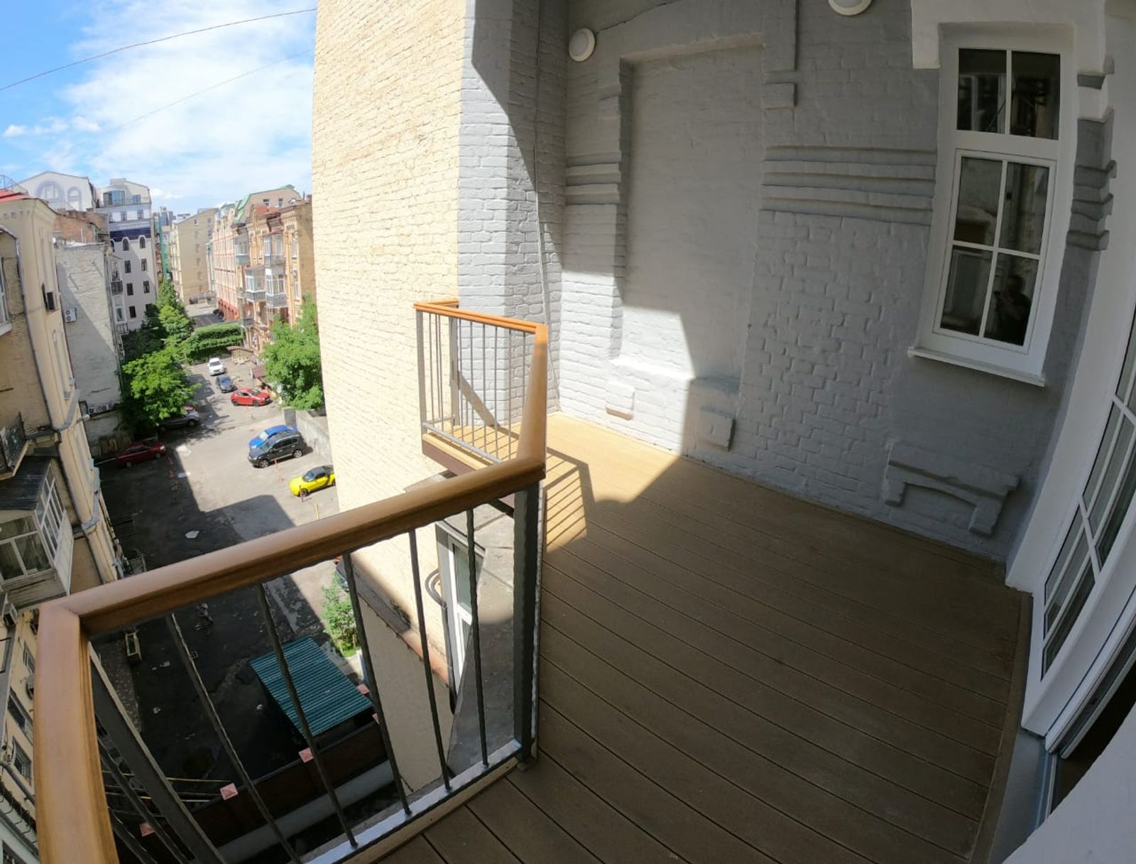 Balcony with wood deck and city view, Kyiv — Vestor.Estate