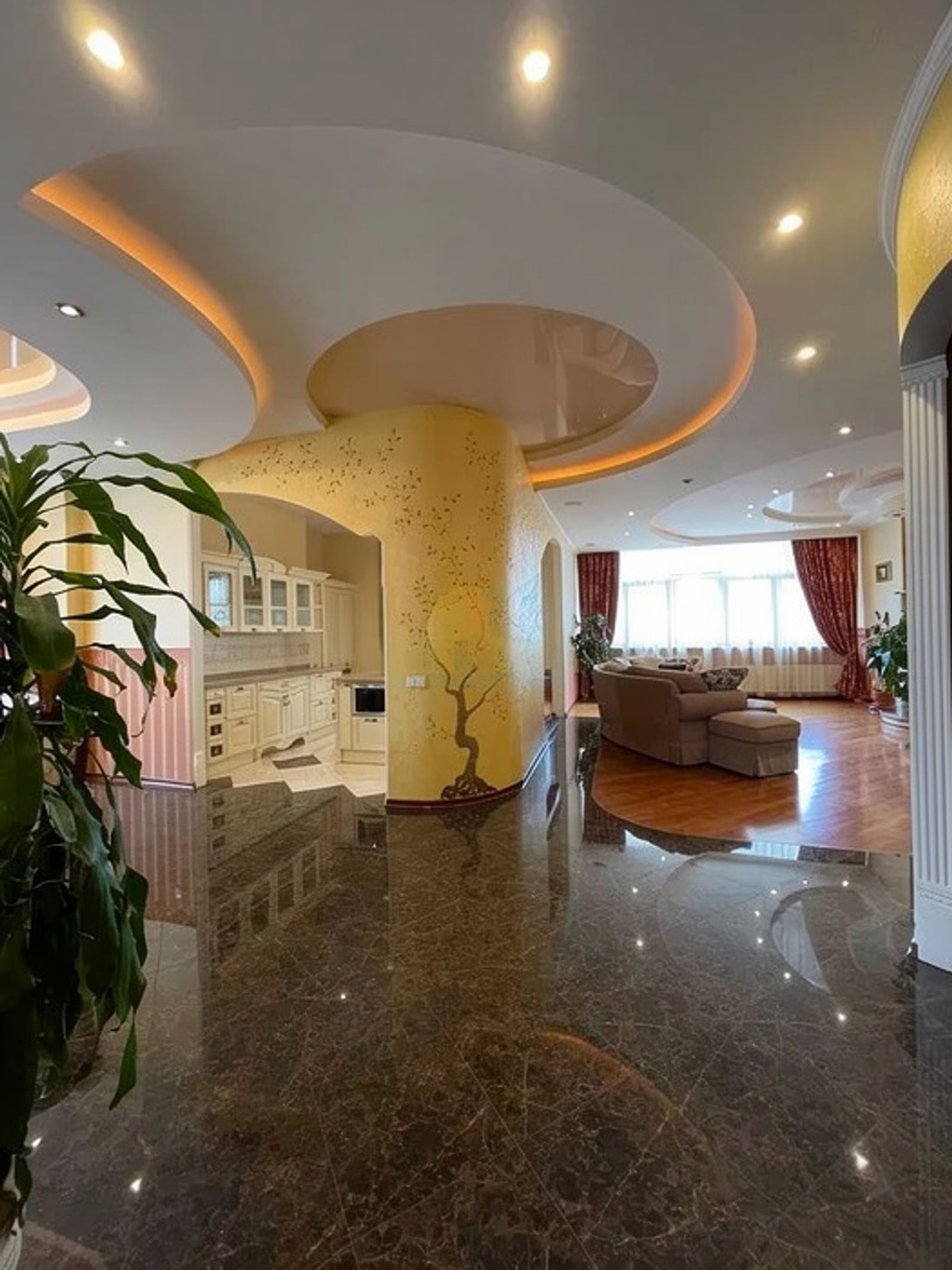 Spacious living area with curved ceiling, marble floors, and kitchen, Liuteranska 10A, Kyiv — Vestor.Estate