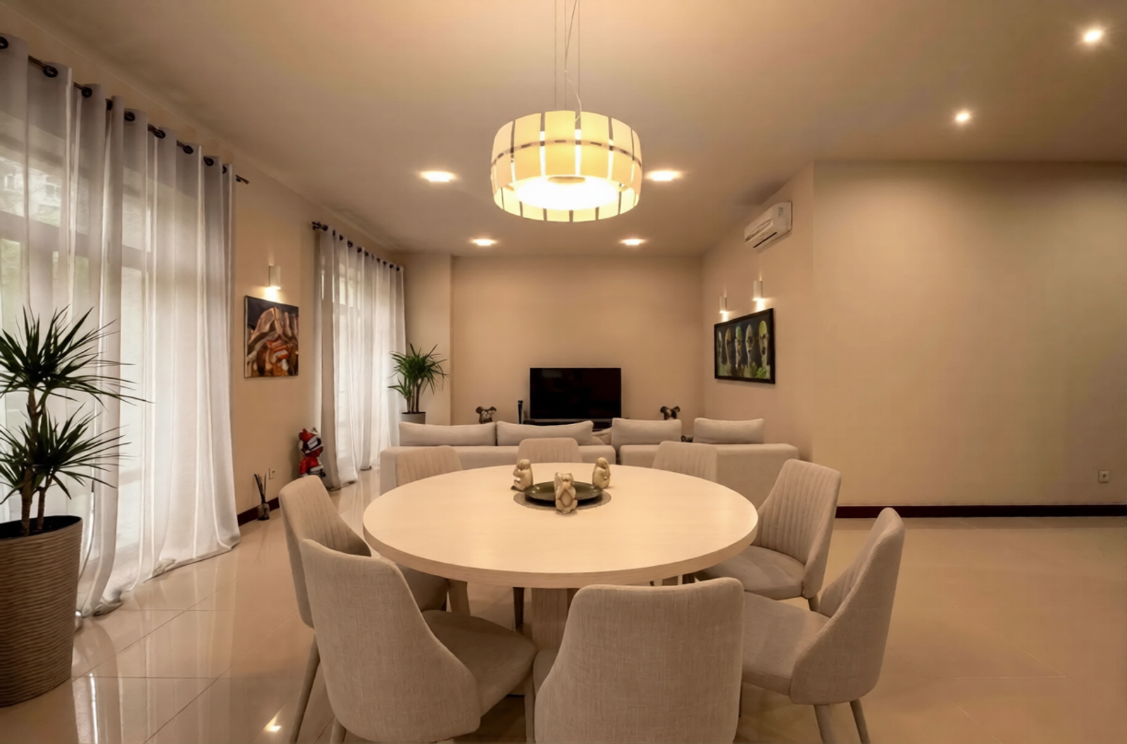 Dining area with round table, light, and plush seating, Khreshchatyk 27B, Kyiv — Vestor.Estate
