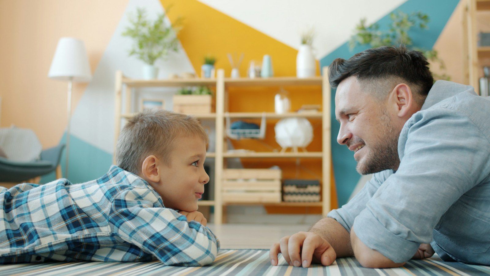 A father and son looking at each other during a quiet, open conversation