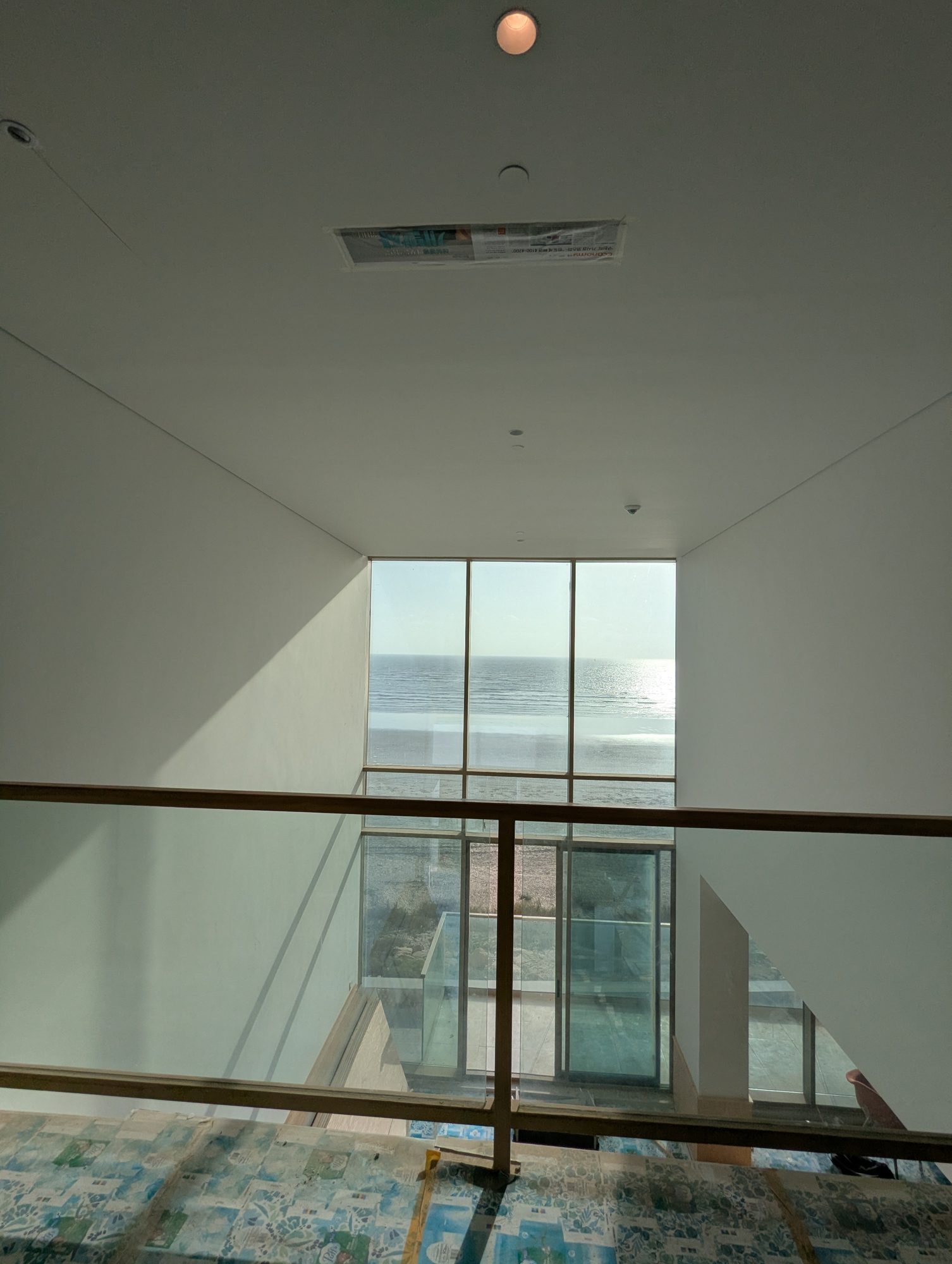 The living room void seen from the mezzanine during fit-out