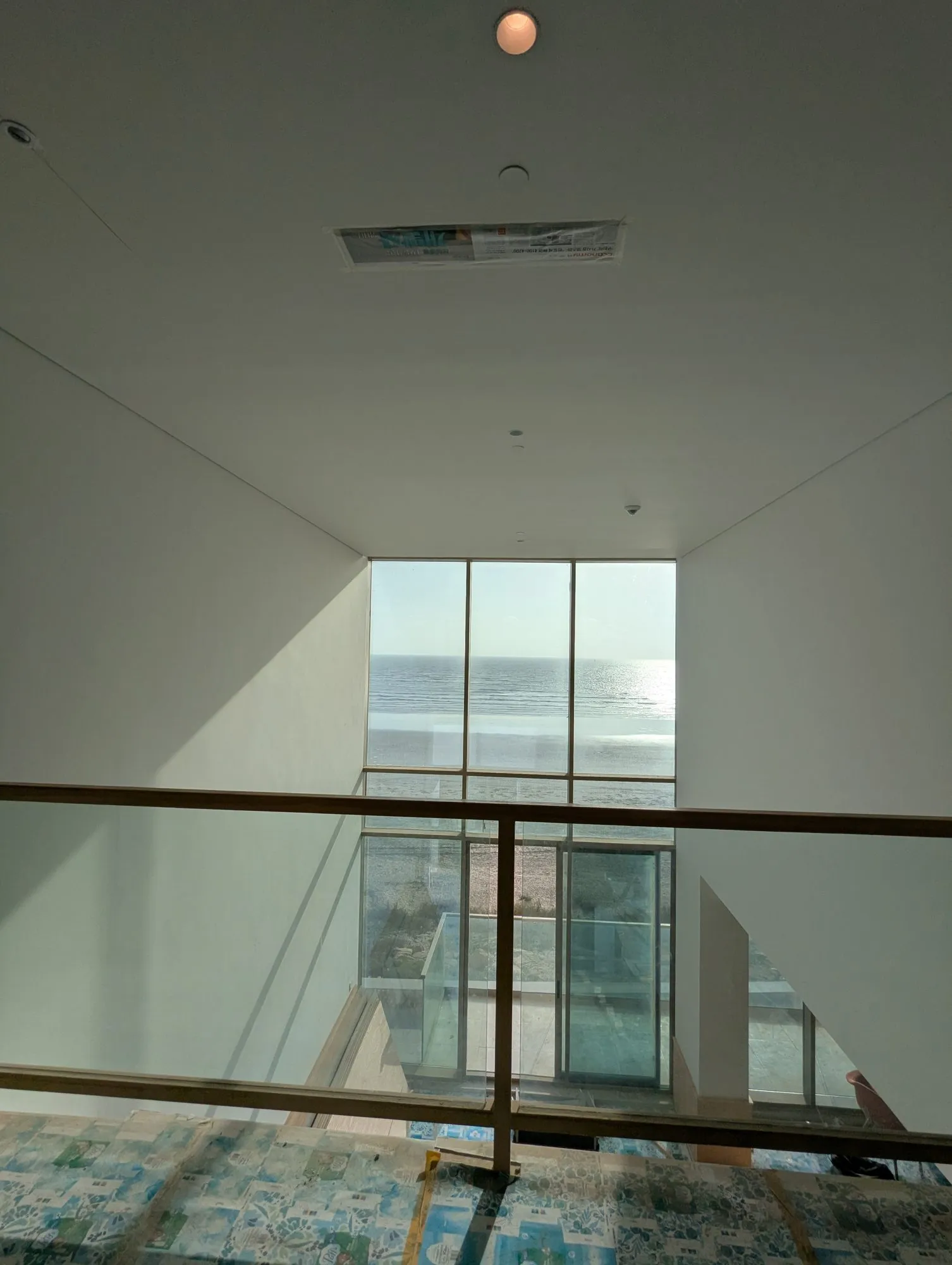The living room void seen from the mezzanine during fit-out