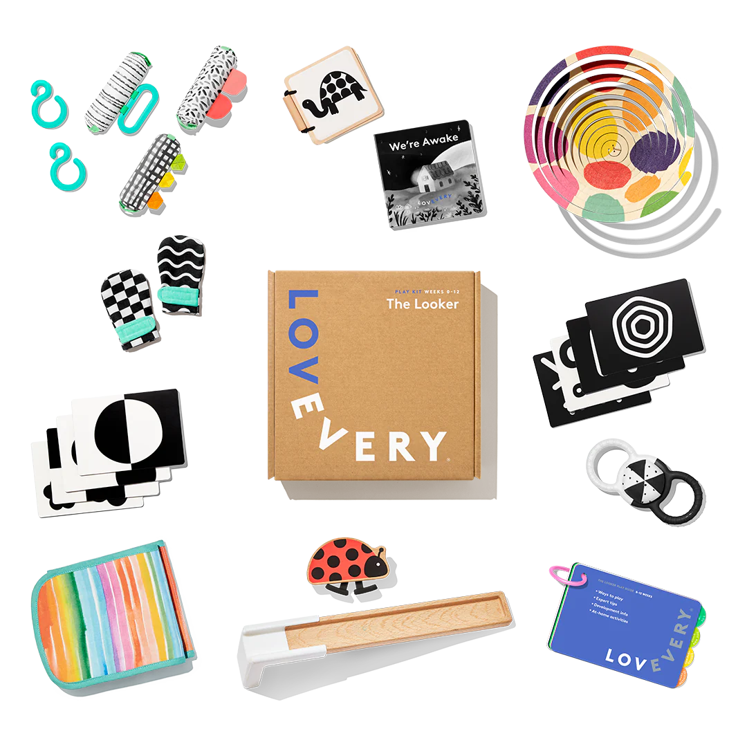 Lovevery The Looker Play Kit baby toys flatlay with high-contrast cards, mittens, and play gym pieces