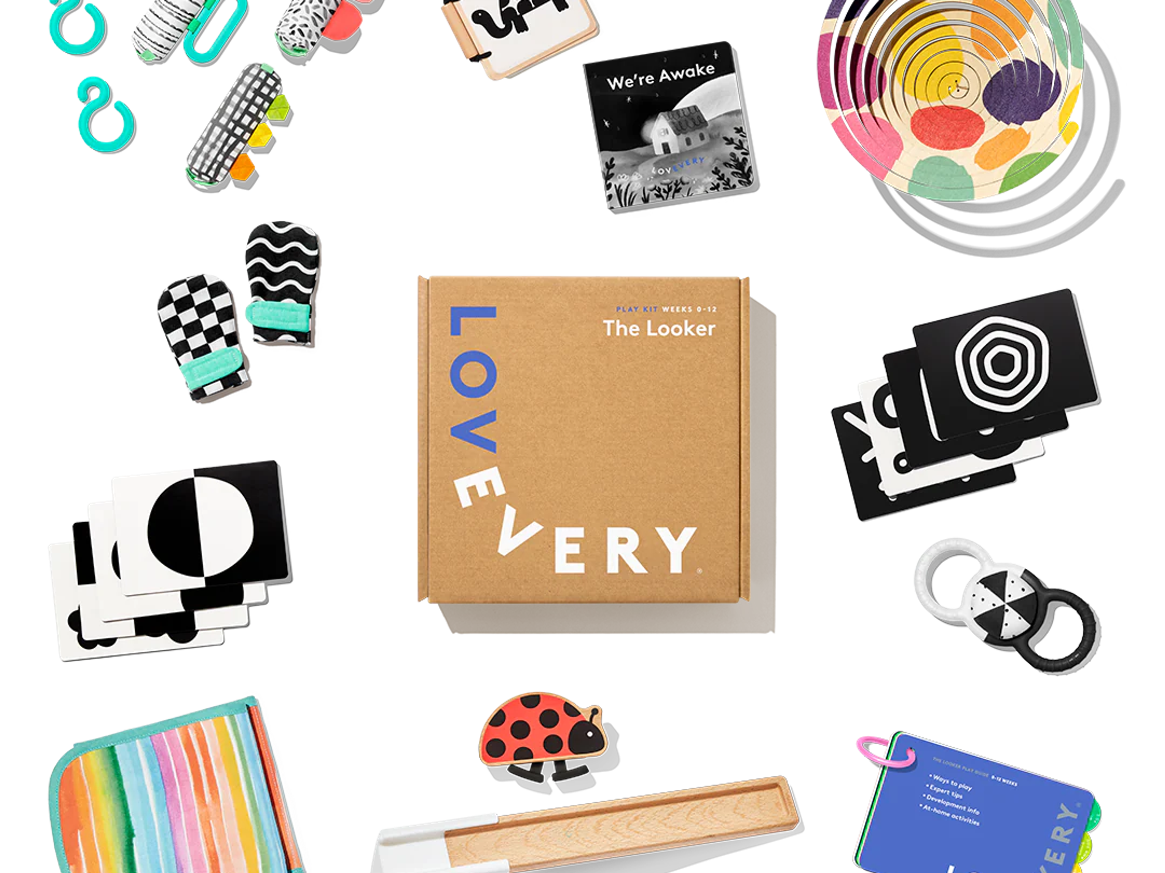 Lovevery The Looker Play Kit baby toys flatlay with high-contrast cards, mittens, and play gym pieces