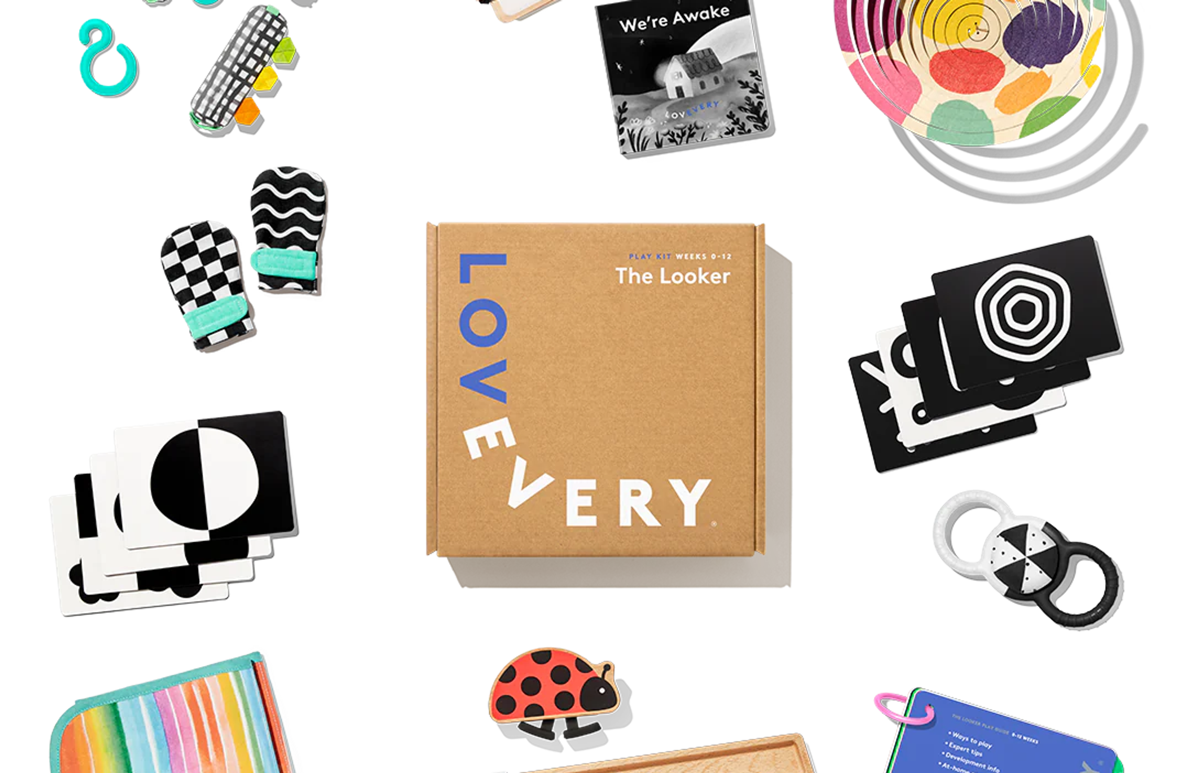 Lovevery The Looker Play Kit baby toys flatlay with high-contrast cards, mittens, and play gym pieces