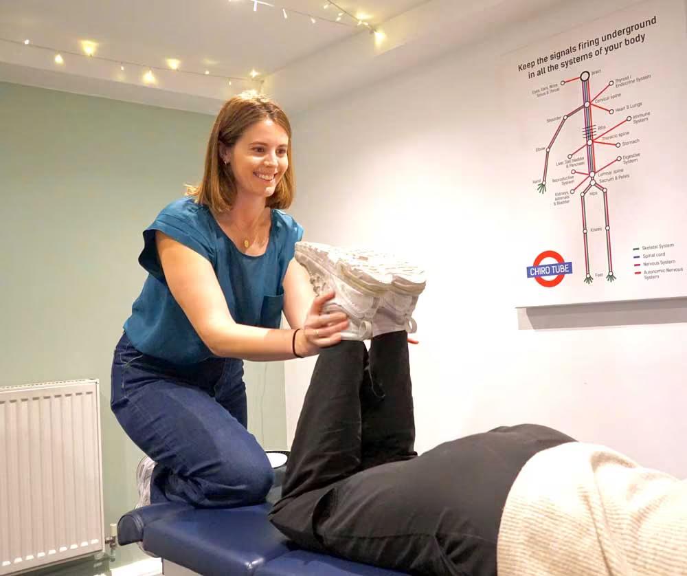 Sports chiropractor treating an athlete on a treatment table after competition