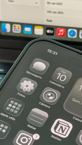 Close-up shot of a smartphone displaying apps and calendar on the screen.