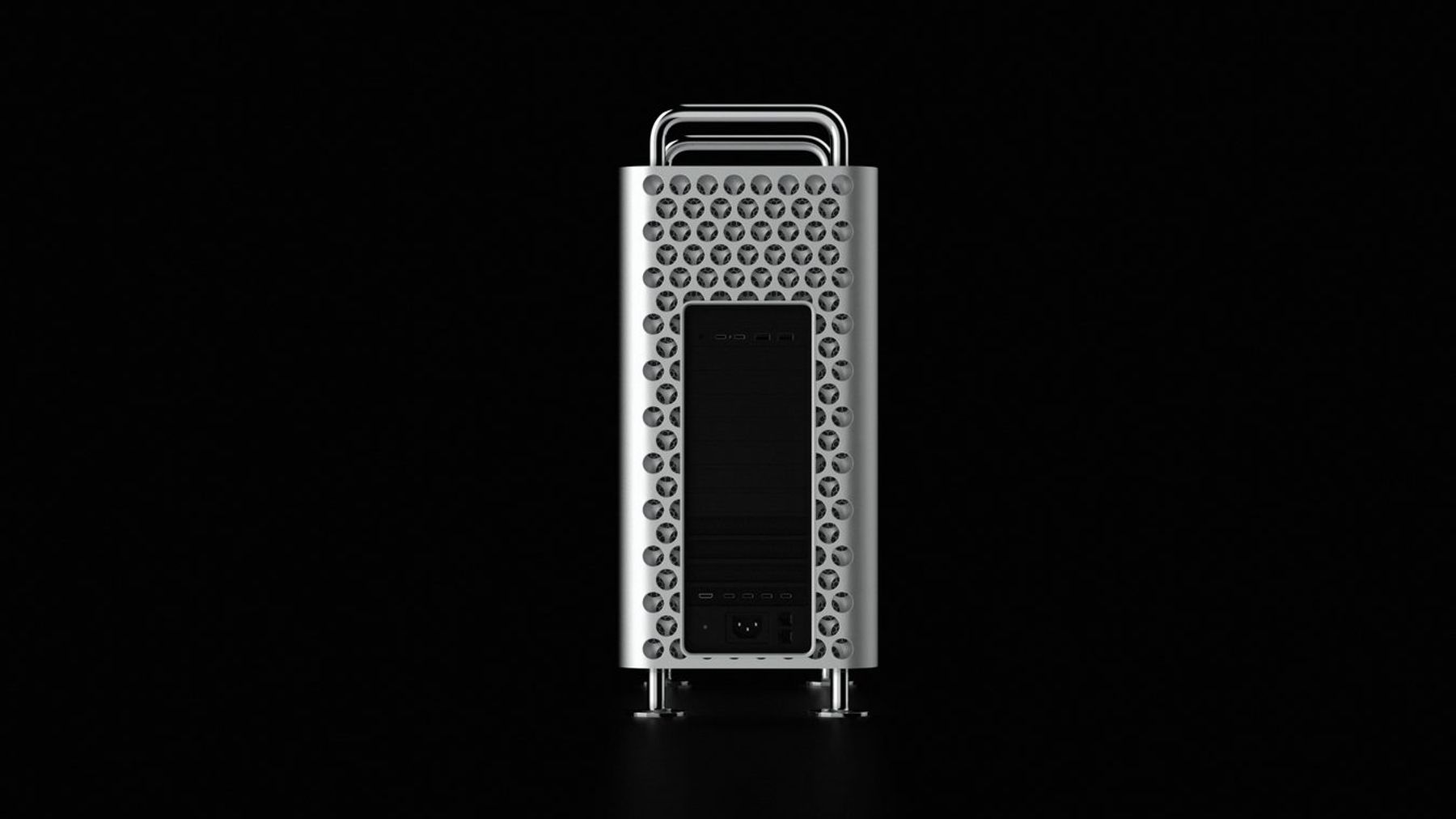 High-resolution image of a modern Apple desktop computer with aluminum chassis and distinctive cheese grater design.