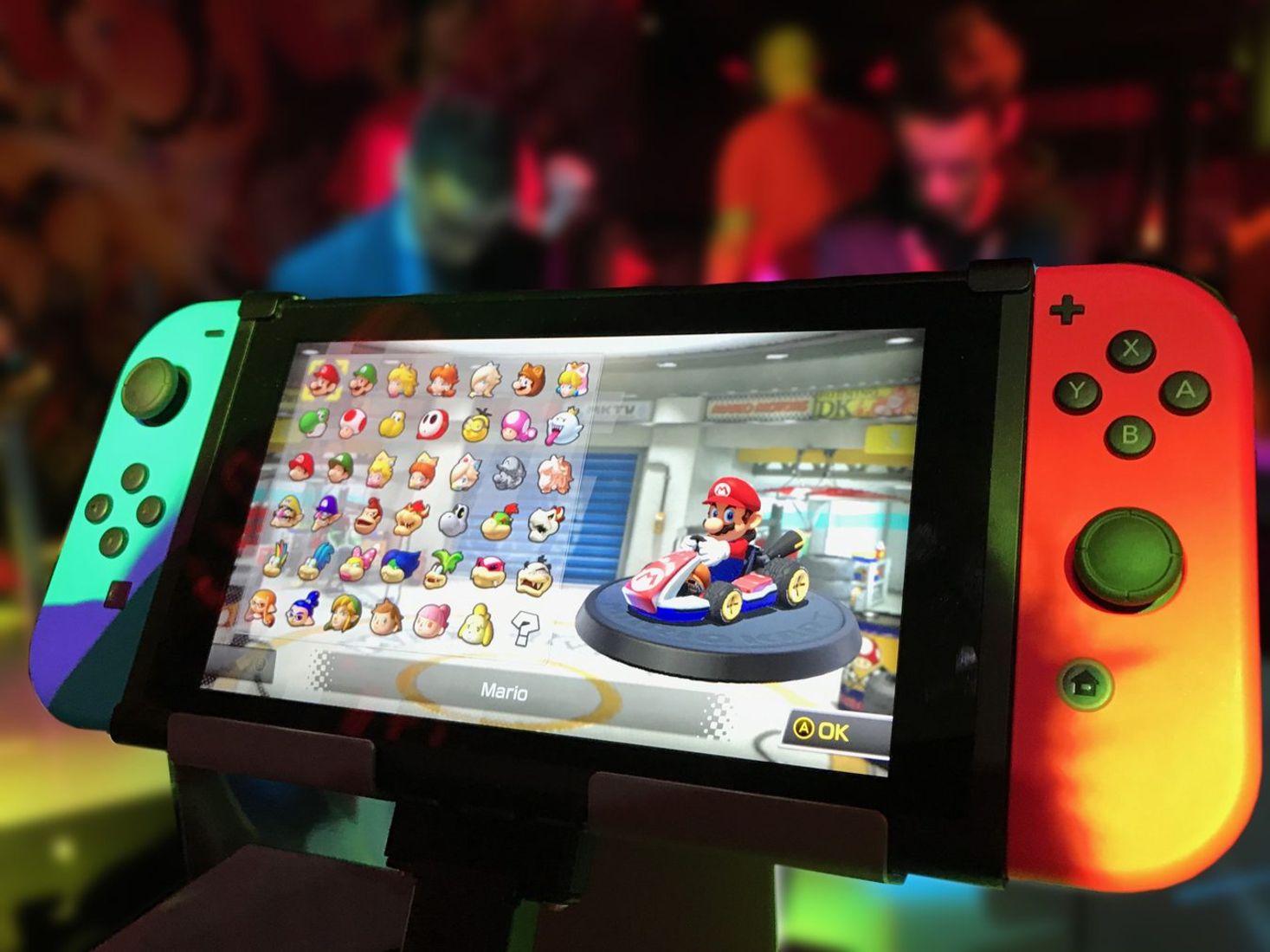 Close-up of a Nintendo Switch showing Mario Kart selection screen.