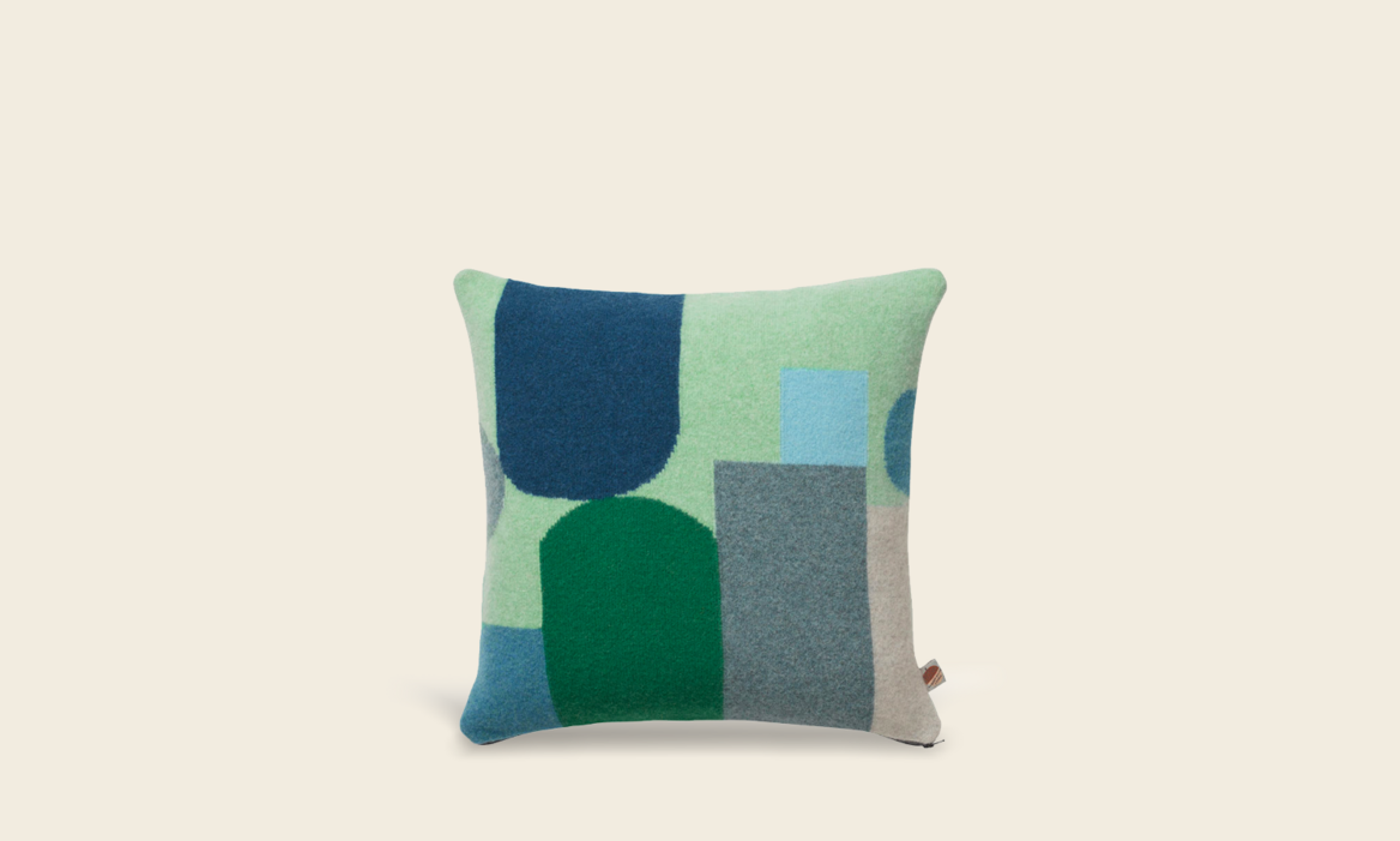 Donna Wilson lambswool cushion with grey, green and blue hues