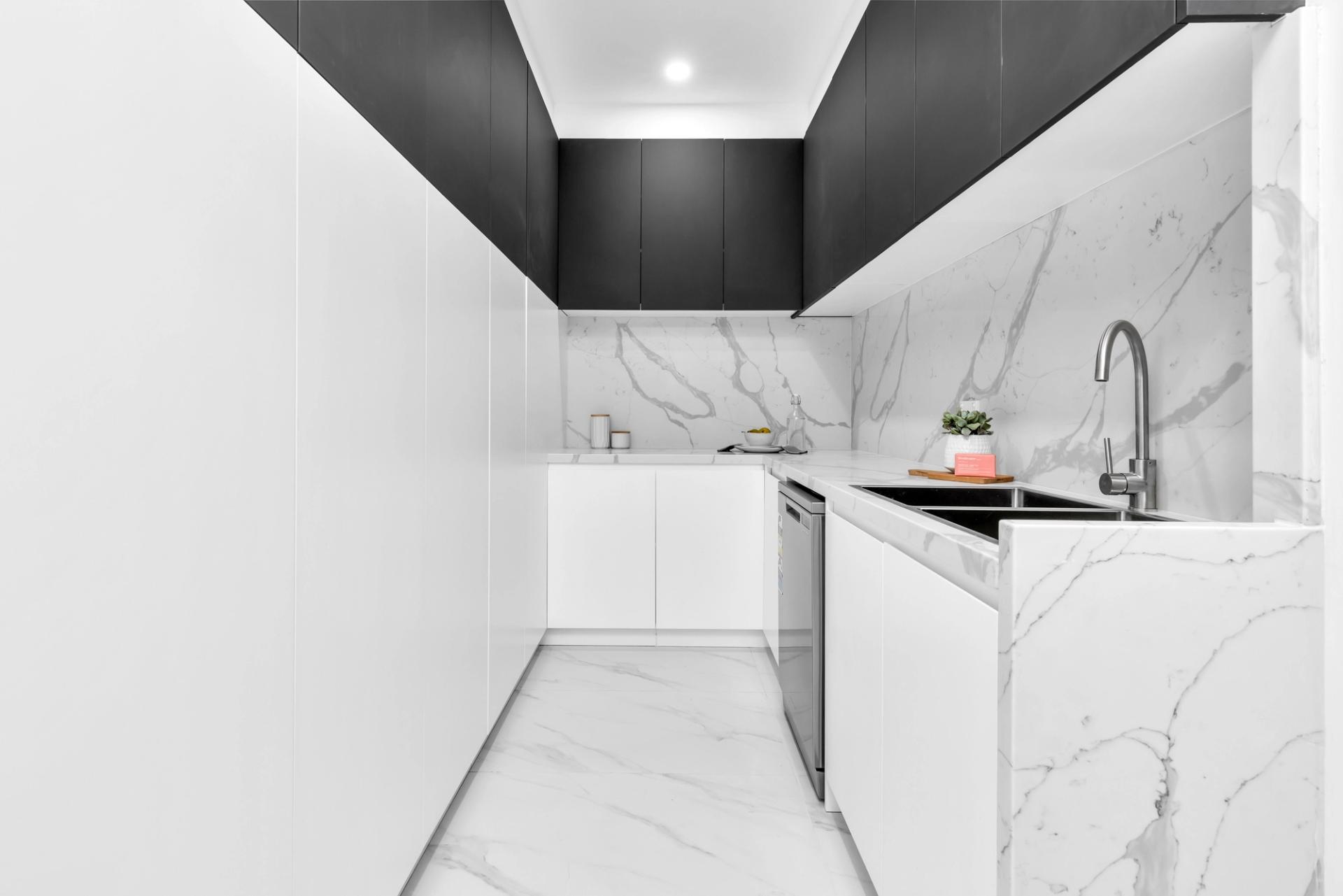 white and black modern butler's pantry with sink, dishwasher & storage, built by Balwin Homes