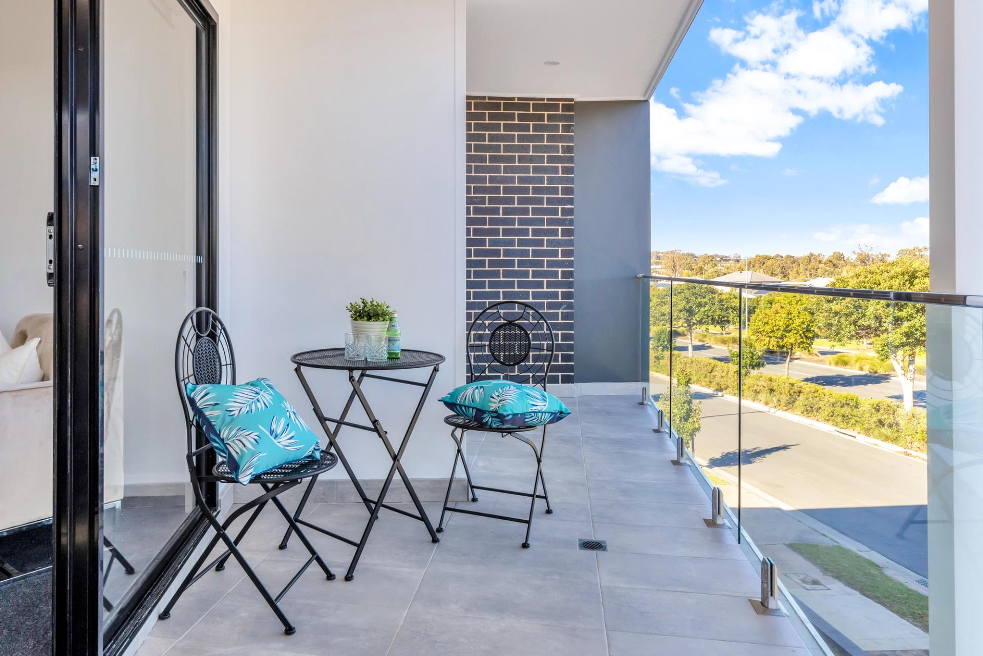 balcony with view of trees and open sky, built by Balwin Homes