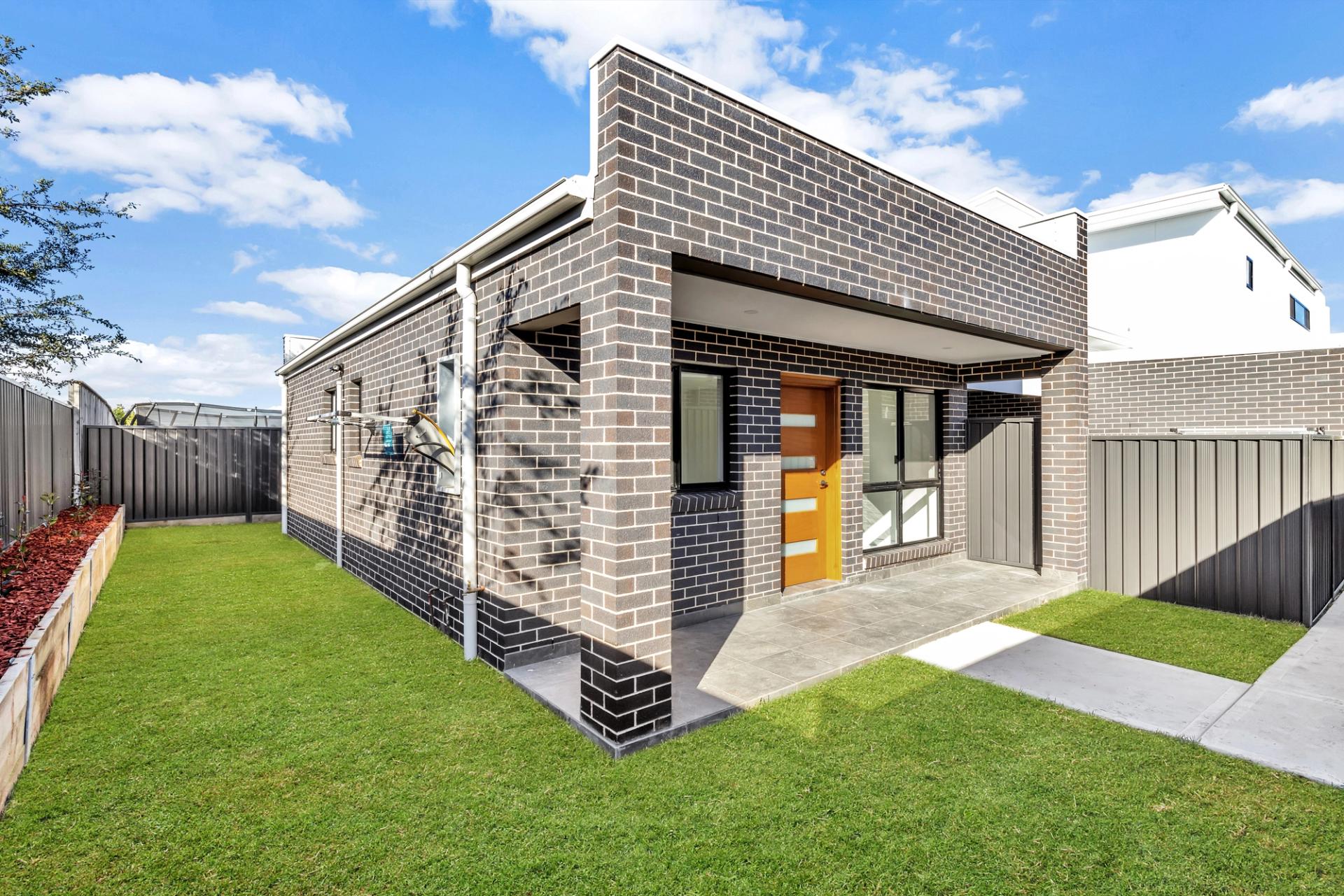 backyard of a double storey modern home, built by Balwin Homes