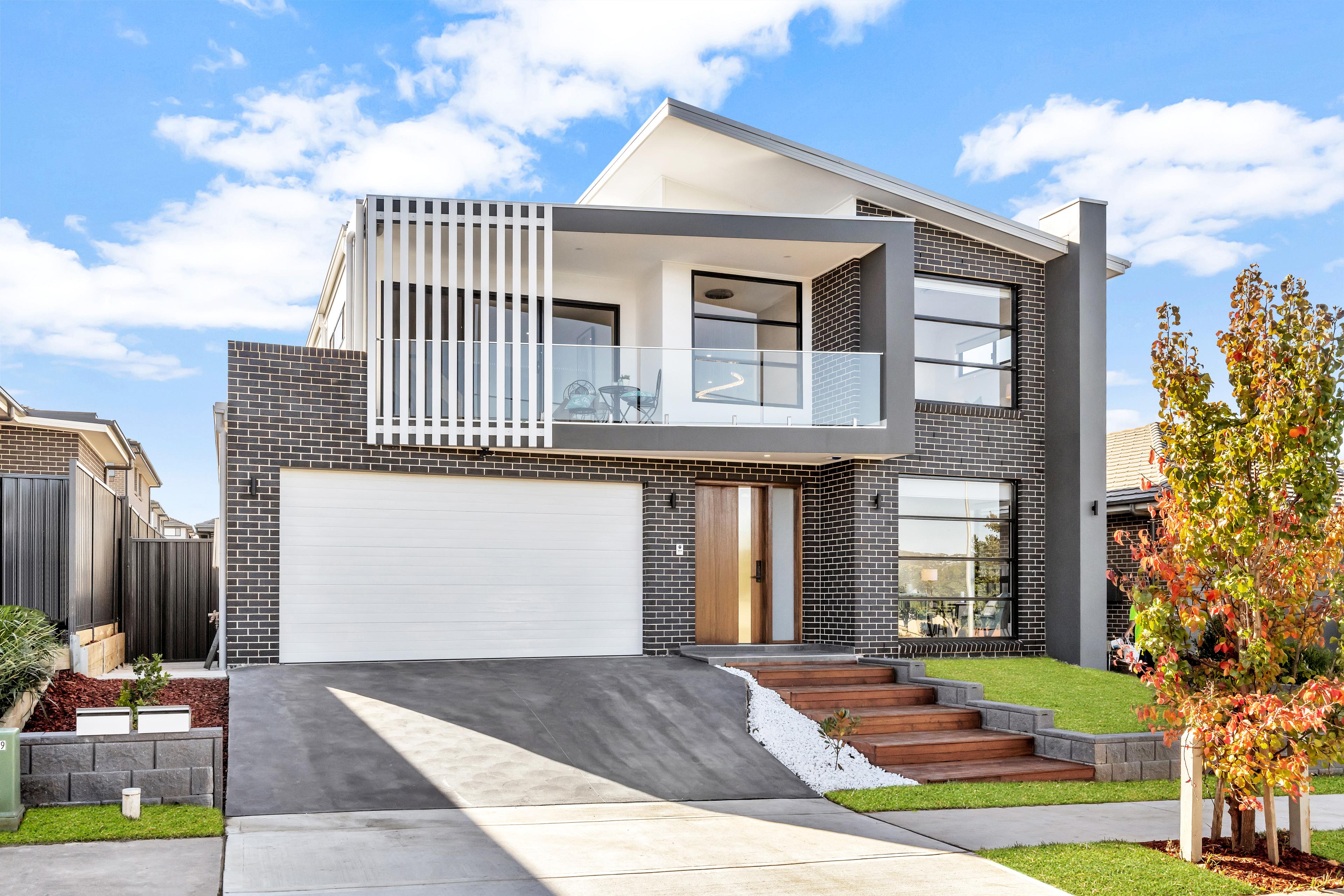 double storey modern home with an outdoor swimming pool