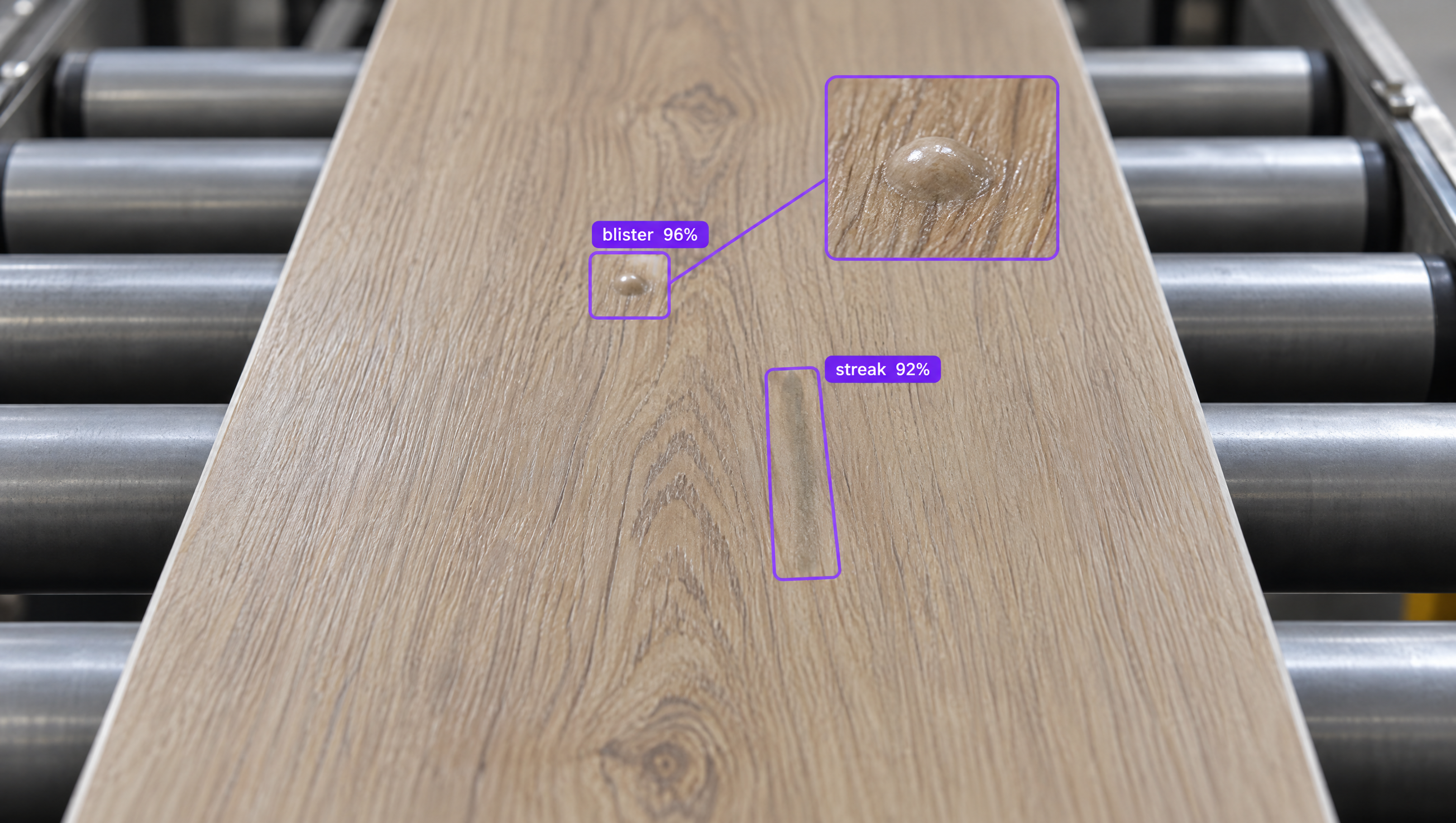 AI-detected blister (magnified) and streak on a wooden plank on a conveyor belt.
