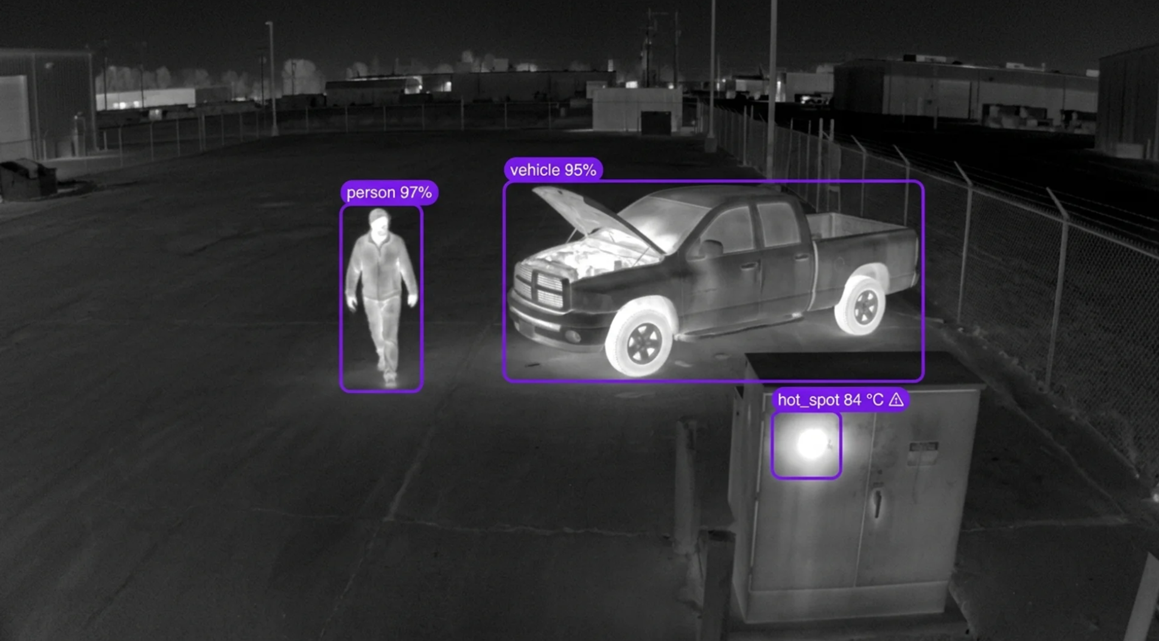 AI-detected thermal image showing a person, a pickup truck with an open hood, and a hot spot on an electrical box.