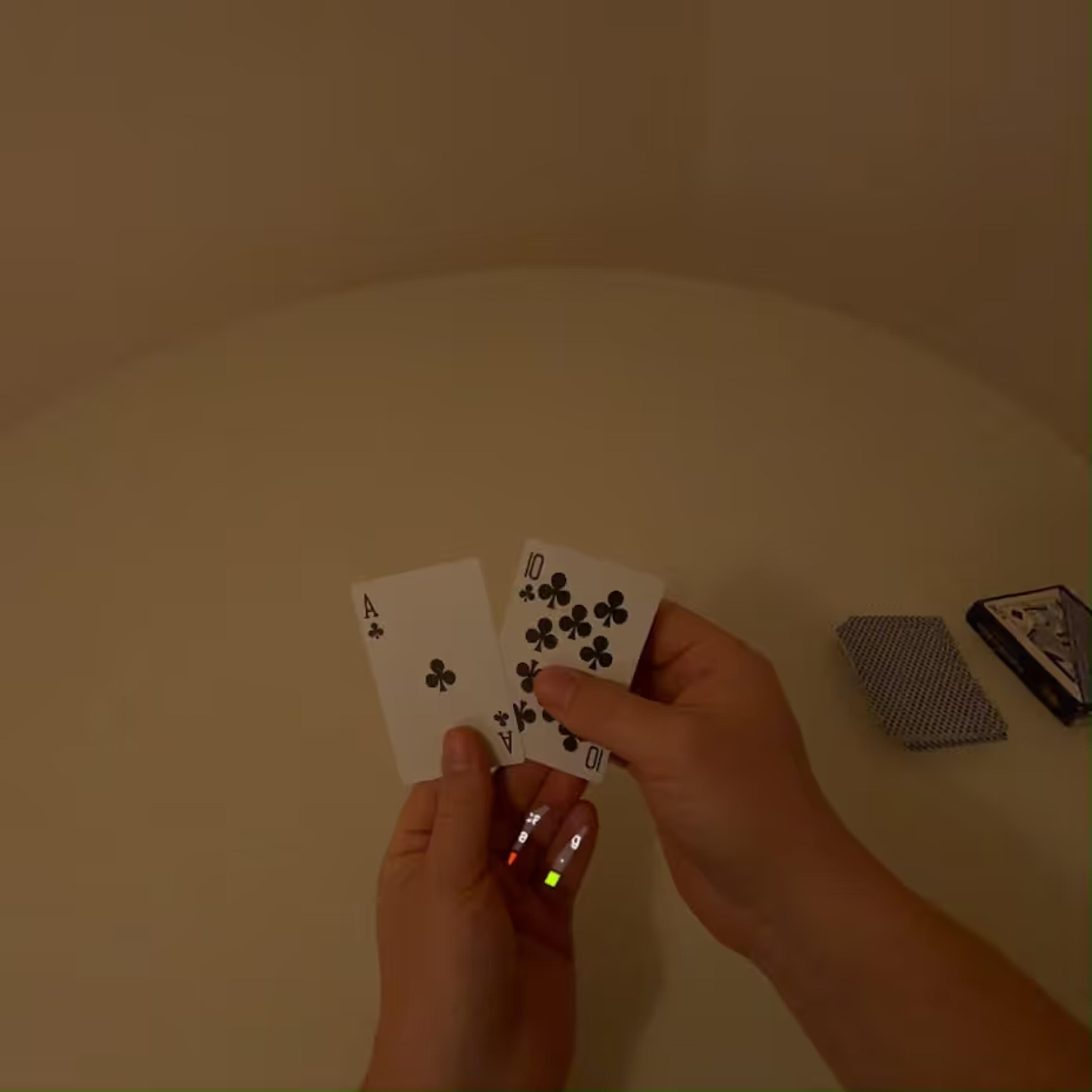 Playing cards held in hand, seen from a wearable camera