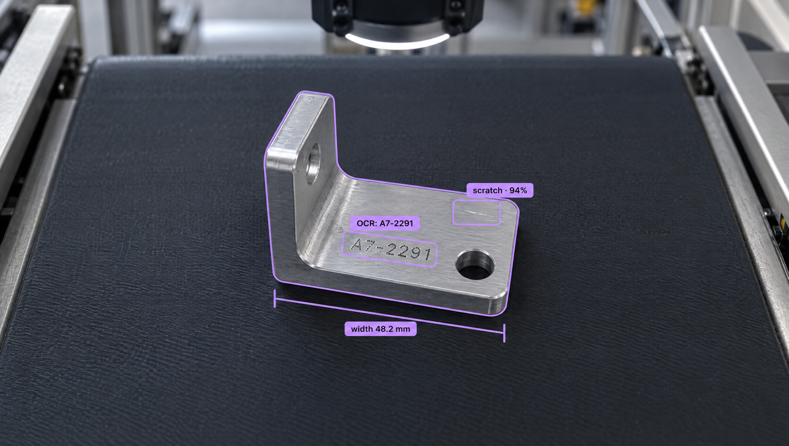 An L-shaped metal bracket on a conveyor belt with purple annotations showing OCR, width measurement, and a detected scratch.