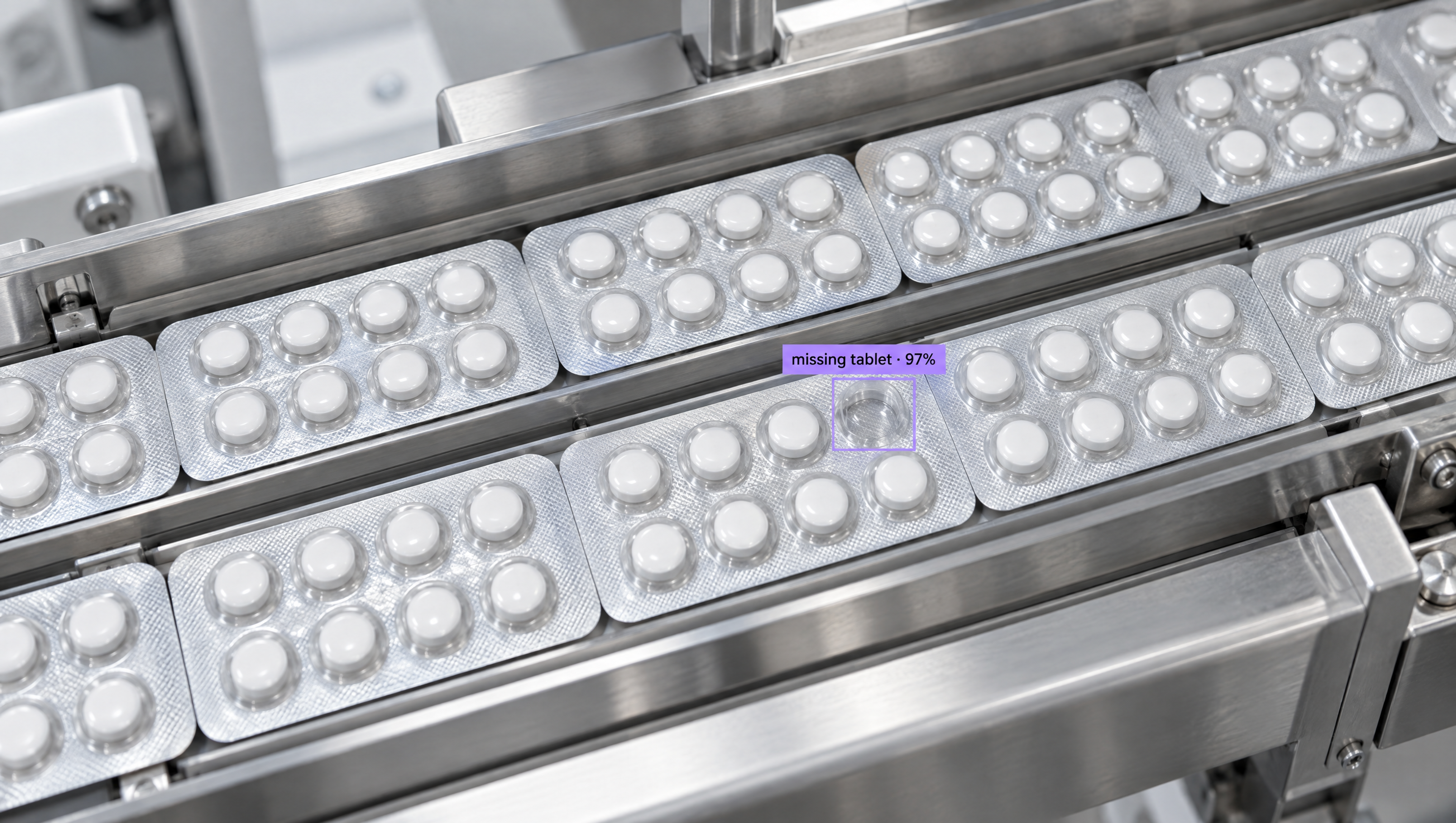 AI detects a missing pill in a blister pack on a factory conveyor belt.