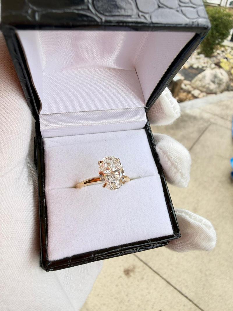 Yellow Gold Oval Centre Stone with Pave Set Halo Engagement Ring