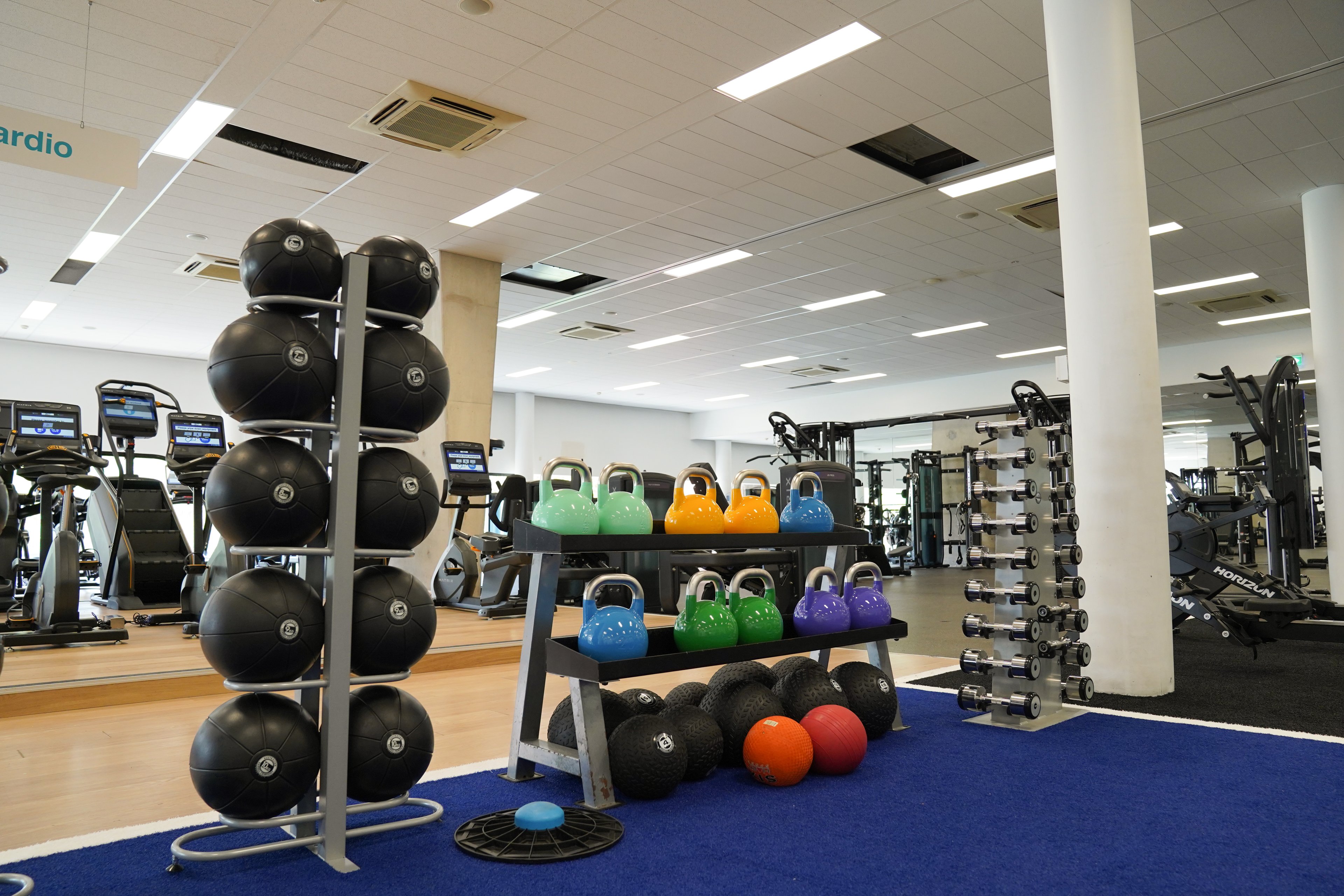 Weights stored in a rack on the gym floor at Ian Thorpe Aquatic Centre