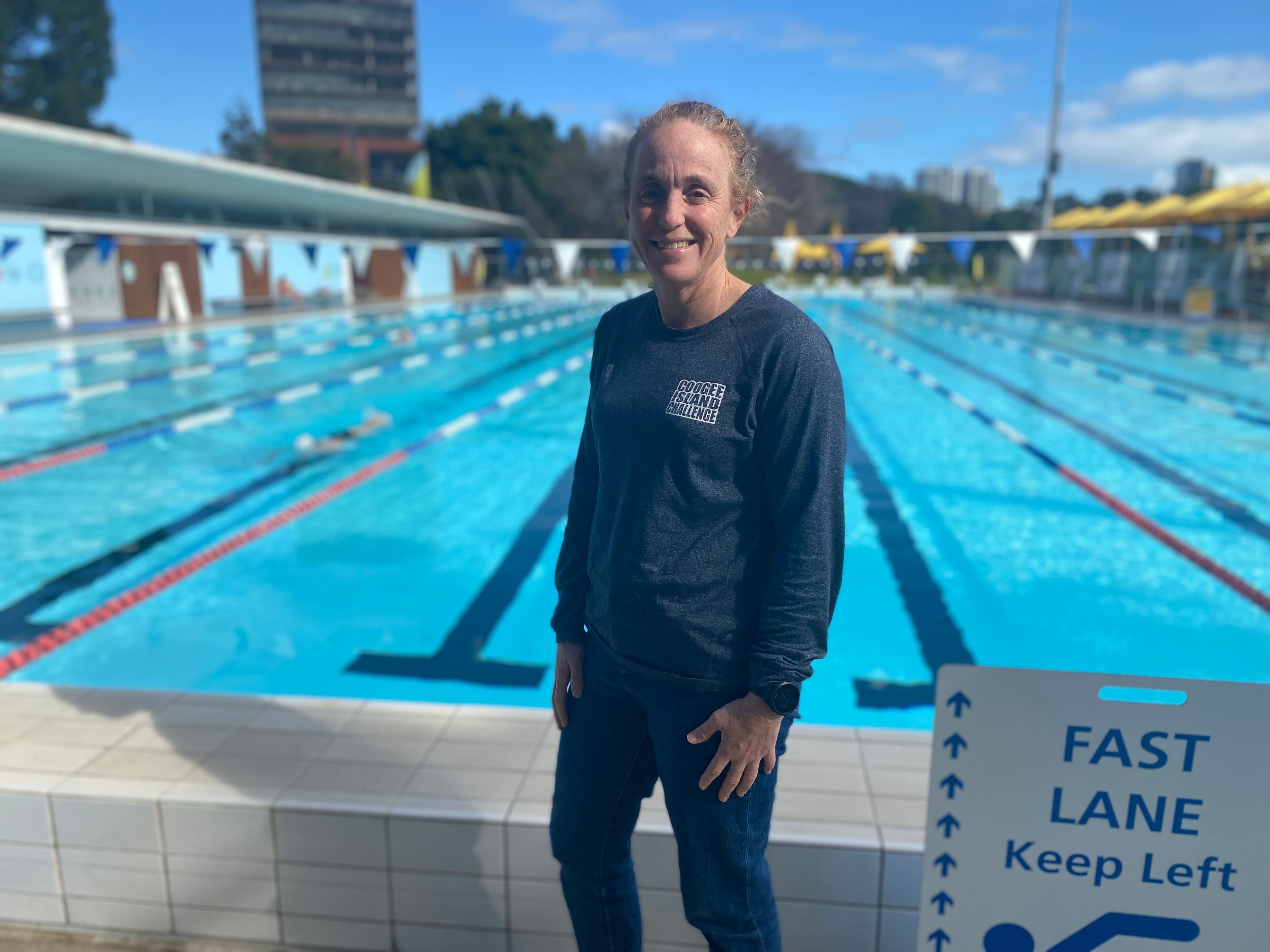 360 member Brittany smiling in front of Prince Alfred Park Pool 