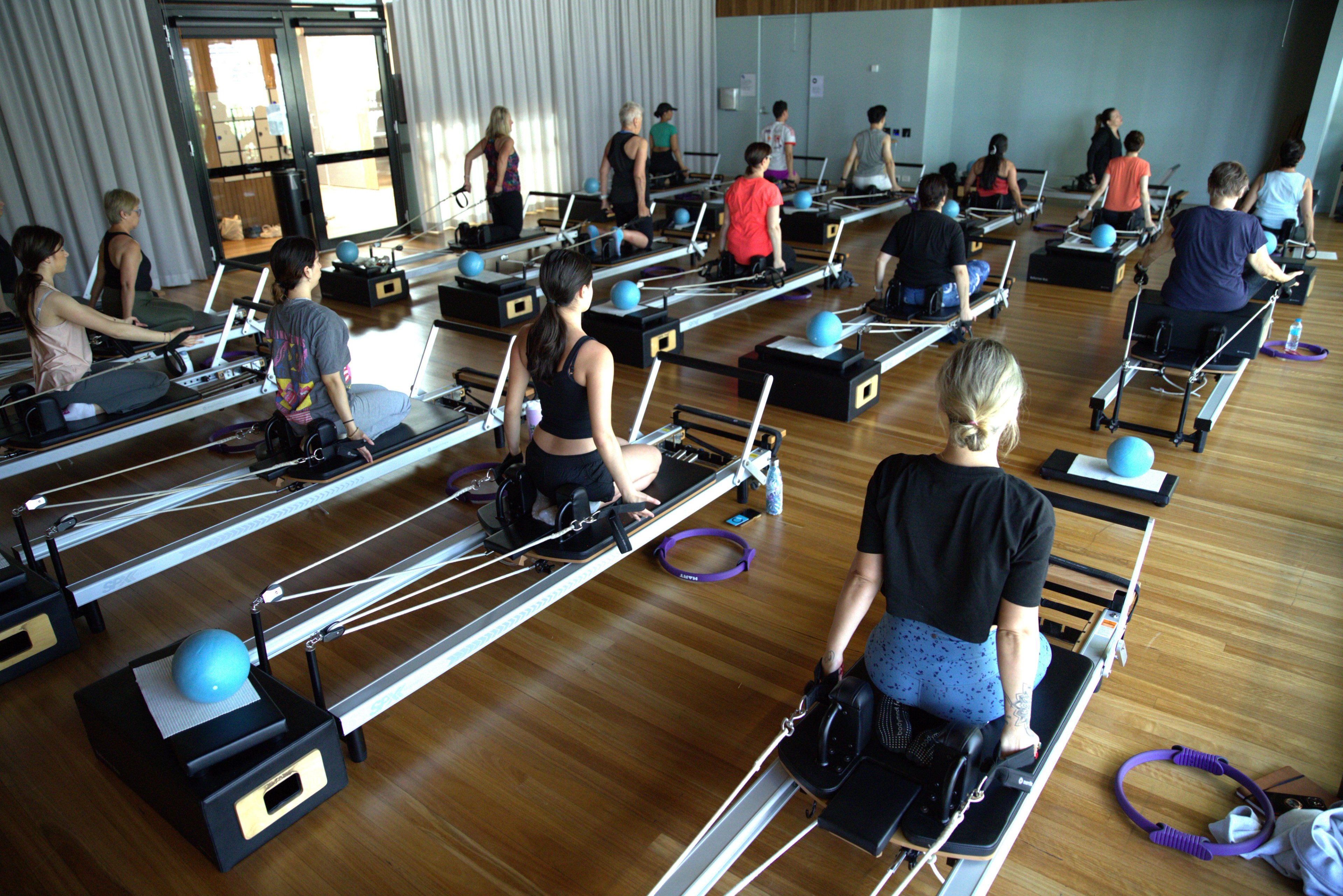 A reformer Pilates class in the studio at Gunyama Park