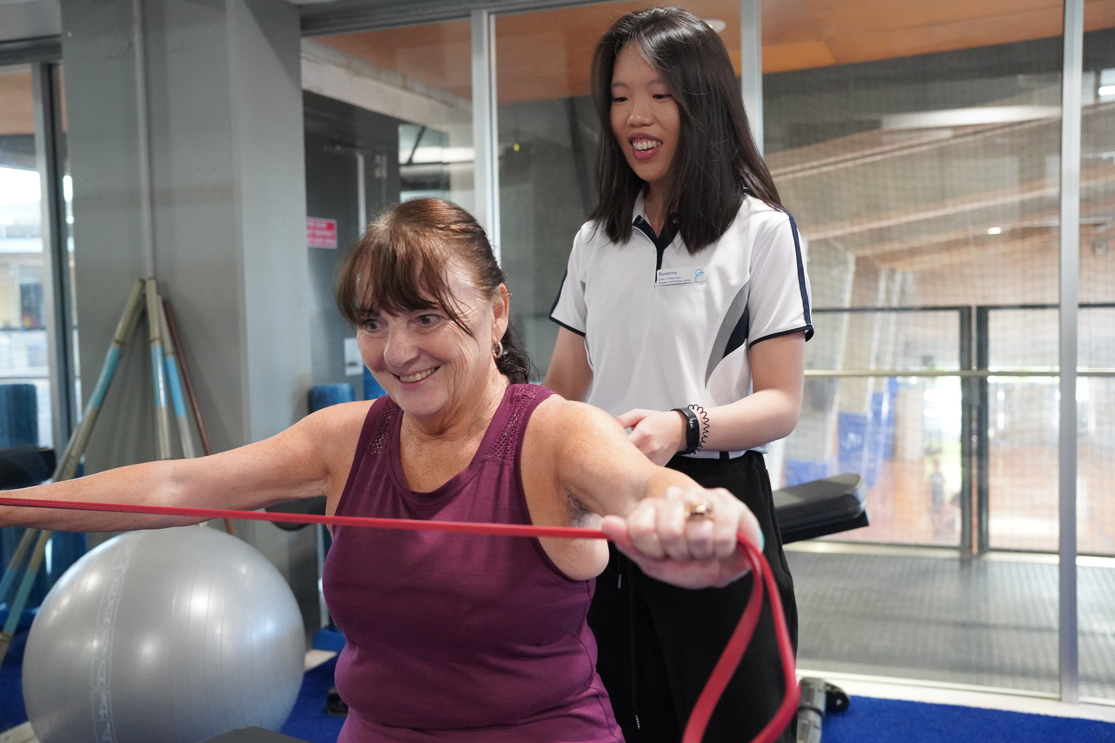 Female exercise physiologist with a female client at Cook + Phillip Park Pool