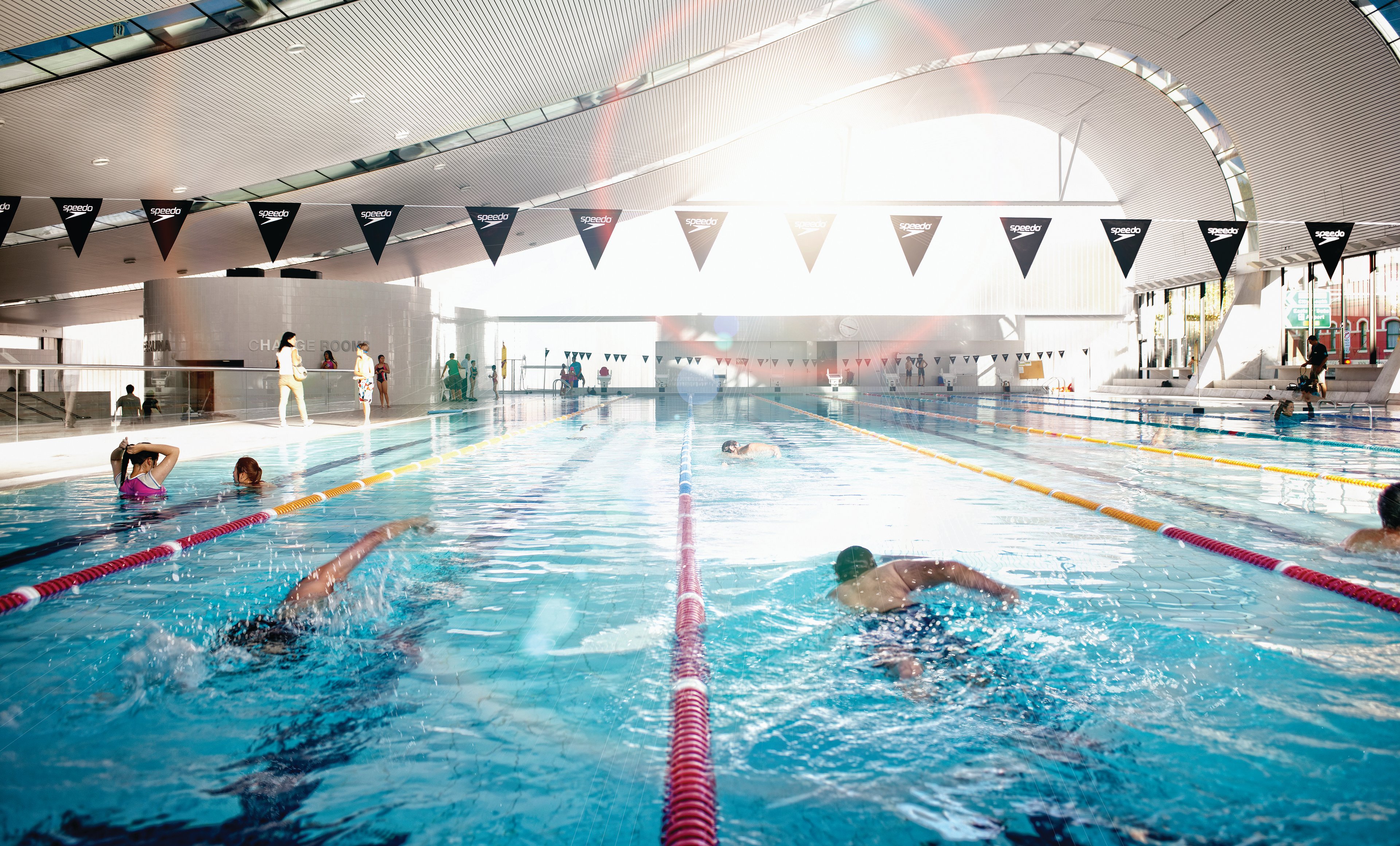 People swimming in the 50m heated pool at Ian Thorpe Aquatic Centre