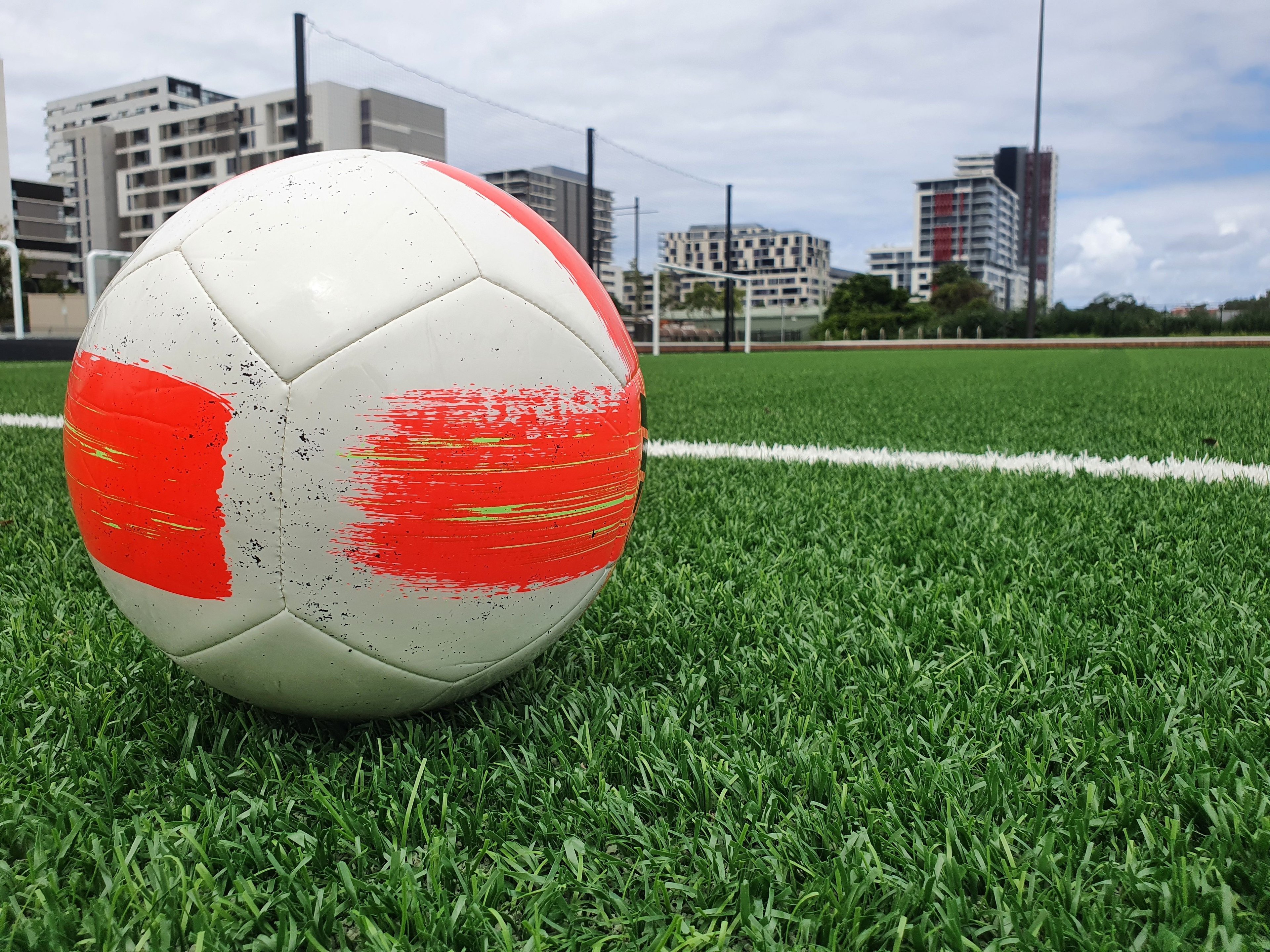 Soccer ball on the synthetic sports field at Gunyama Park