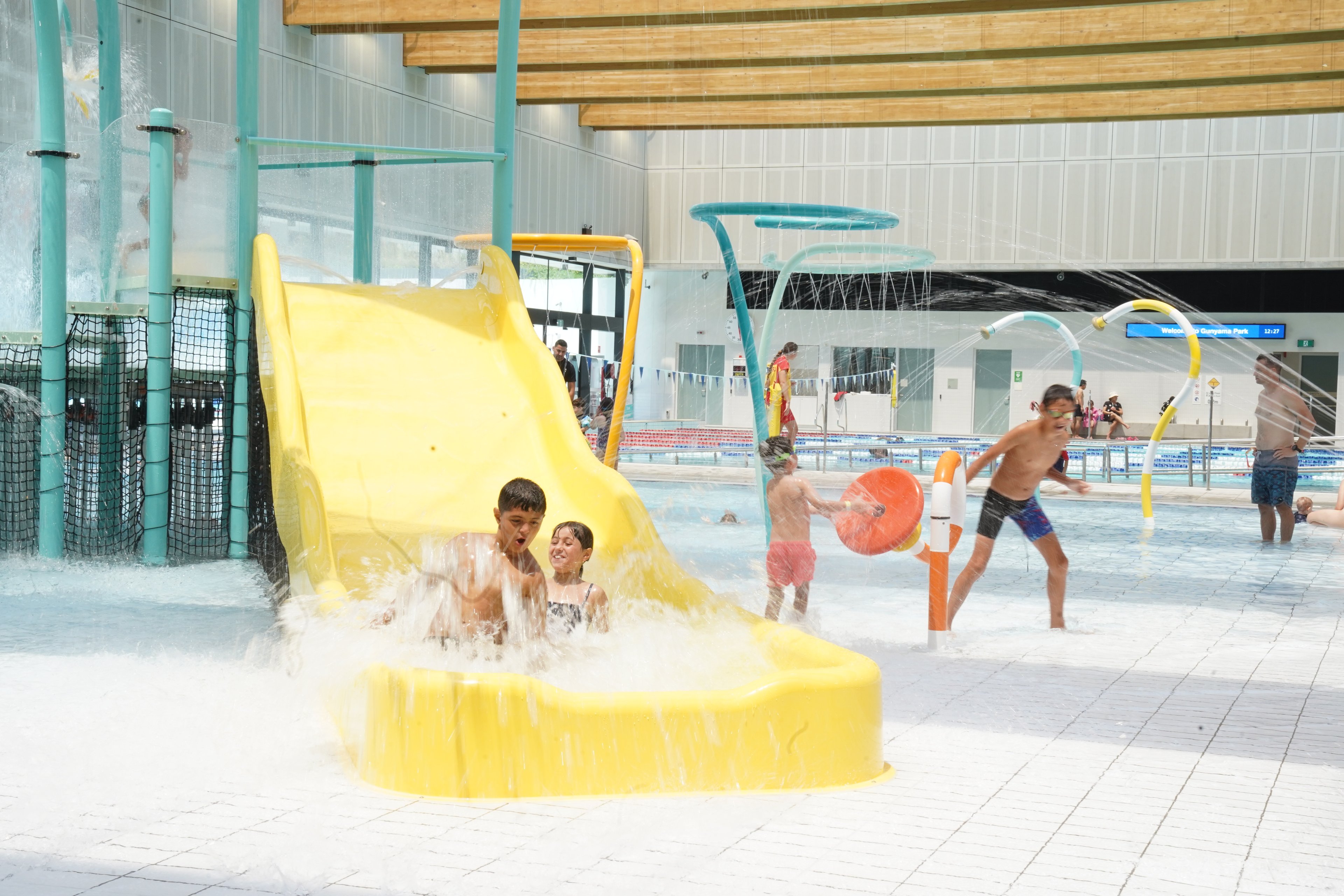 Children in the aqua play area of Gunyama Park pool