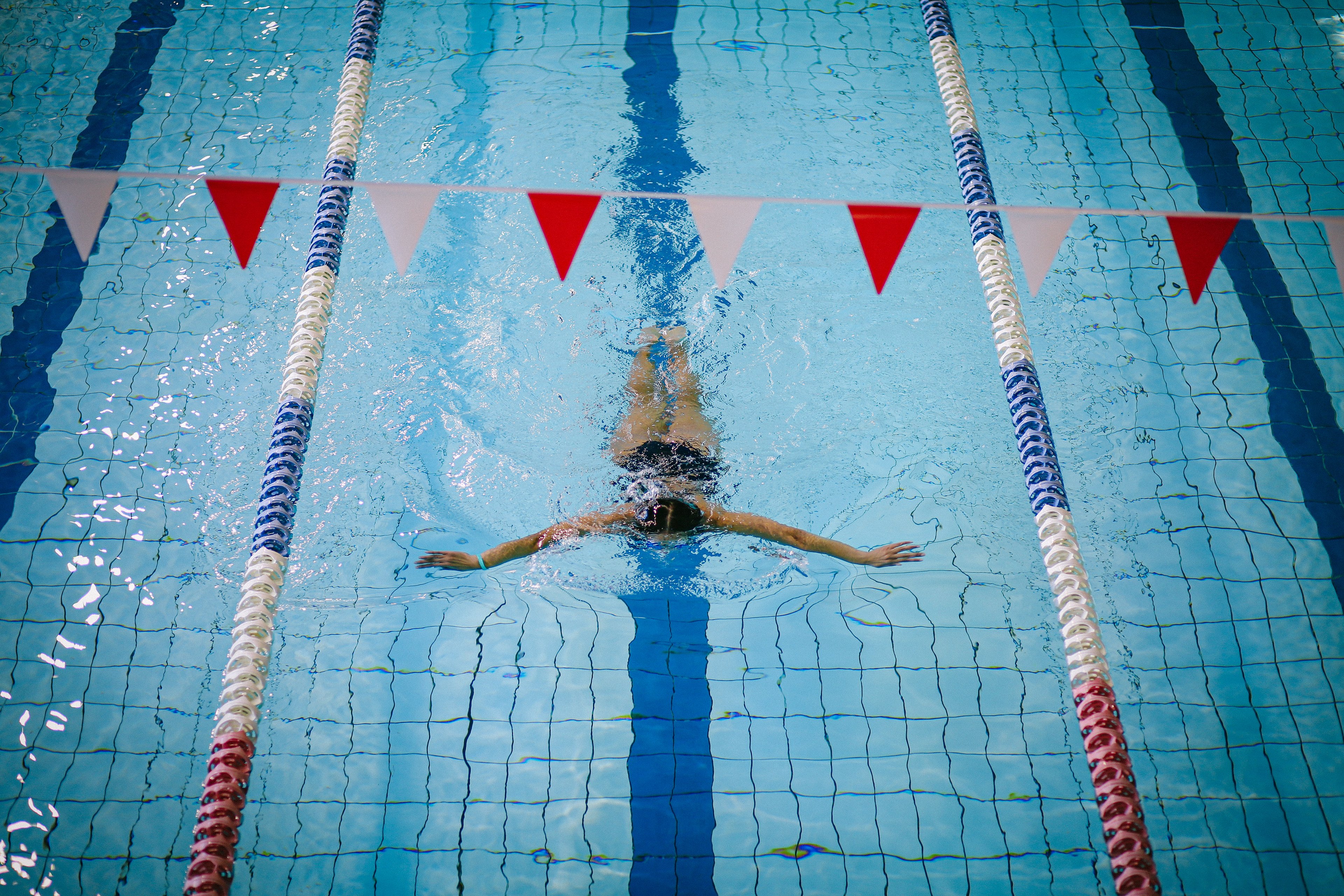 Female swimming on her own at Cook + Phillip Park Pool