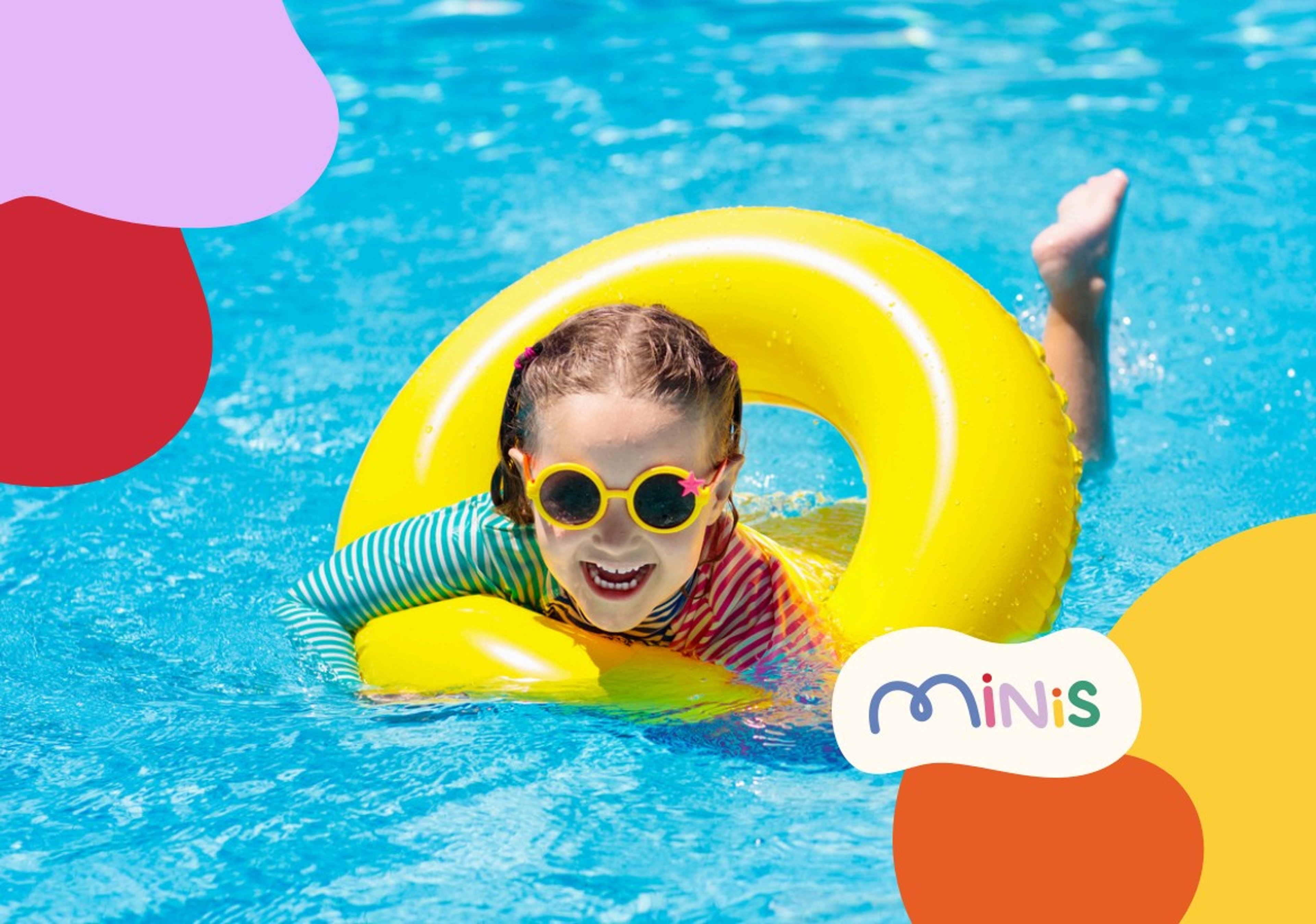 Young girl smiling in the pool, wearing sunglasses and relaxing in a bright yellow floatie.