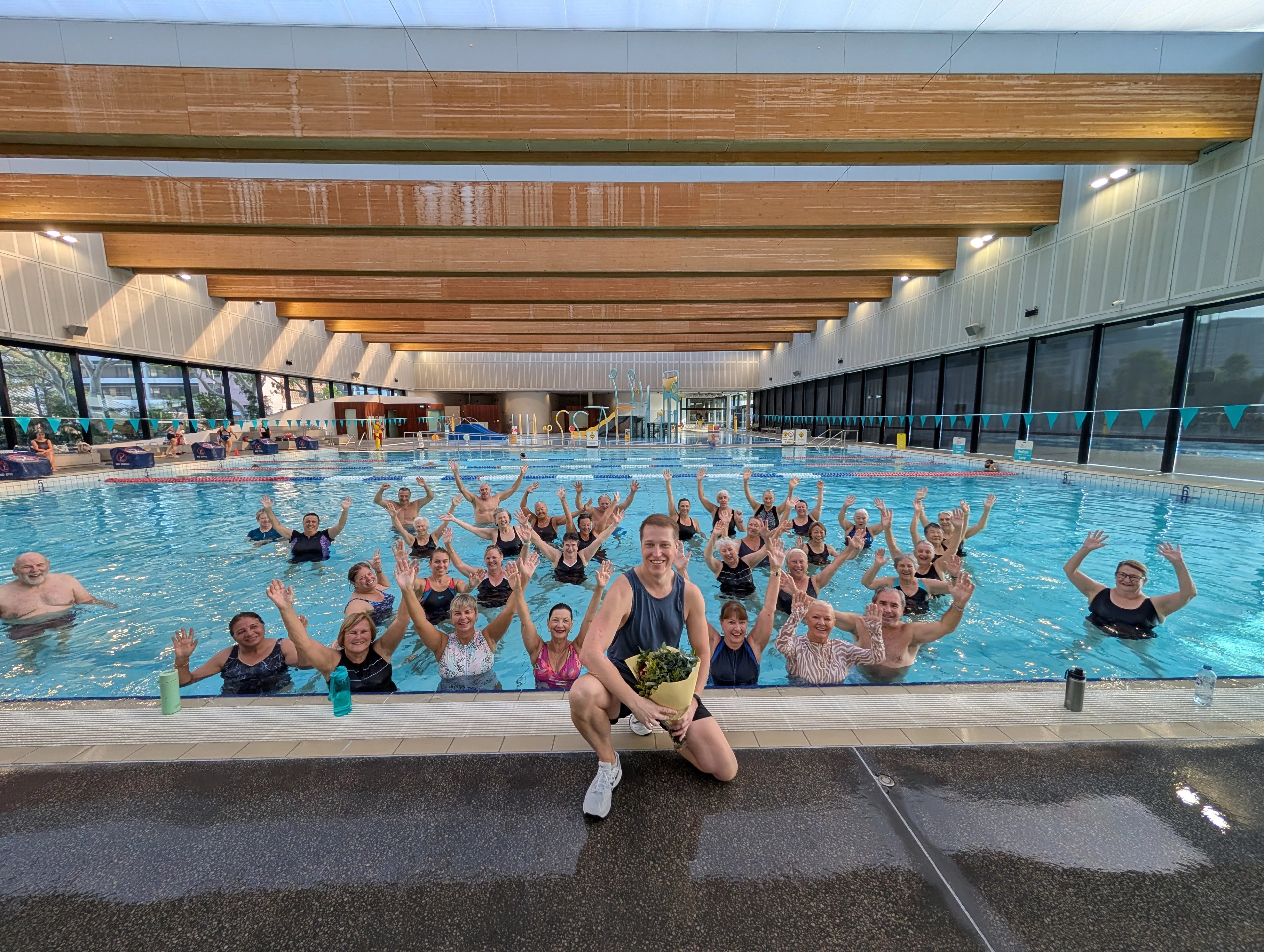 Rob with one of his aqua class groups in front of the indoor pool at Gunyama Park 