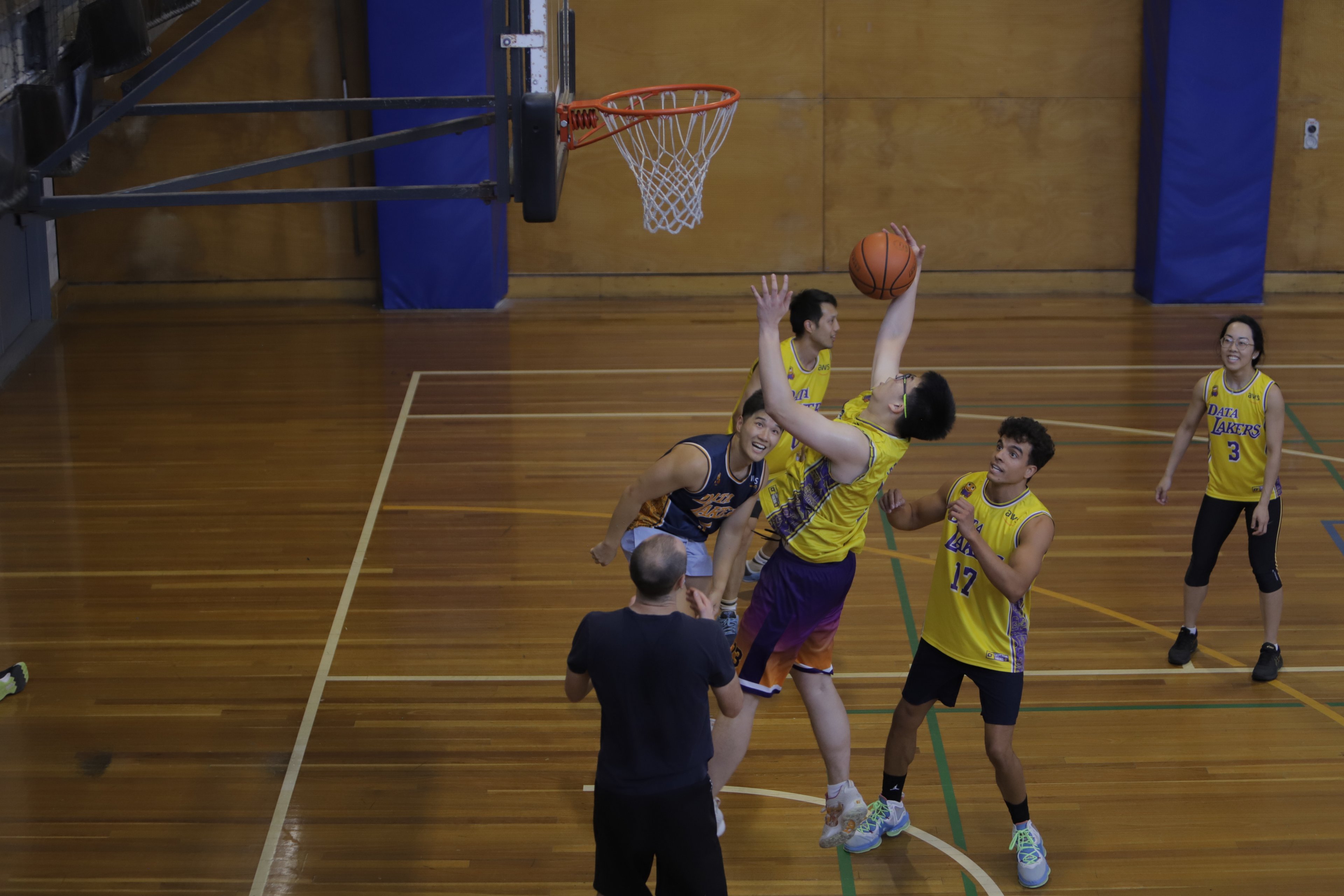 A basketball game on the sports court at Cook and Phillip Park Pool