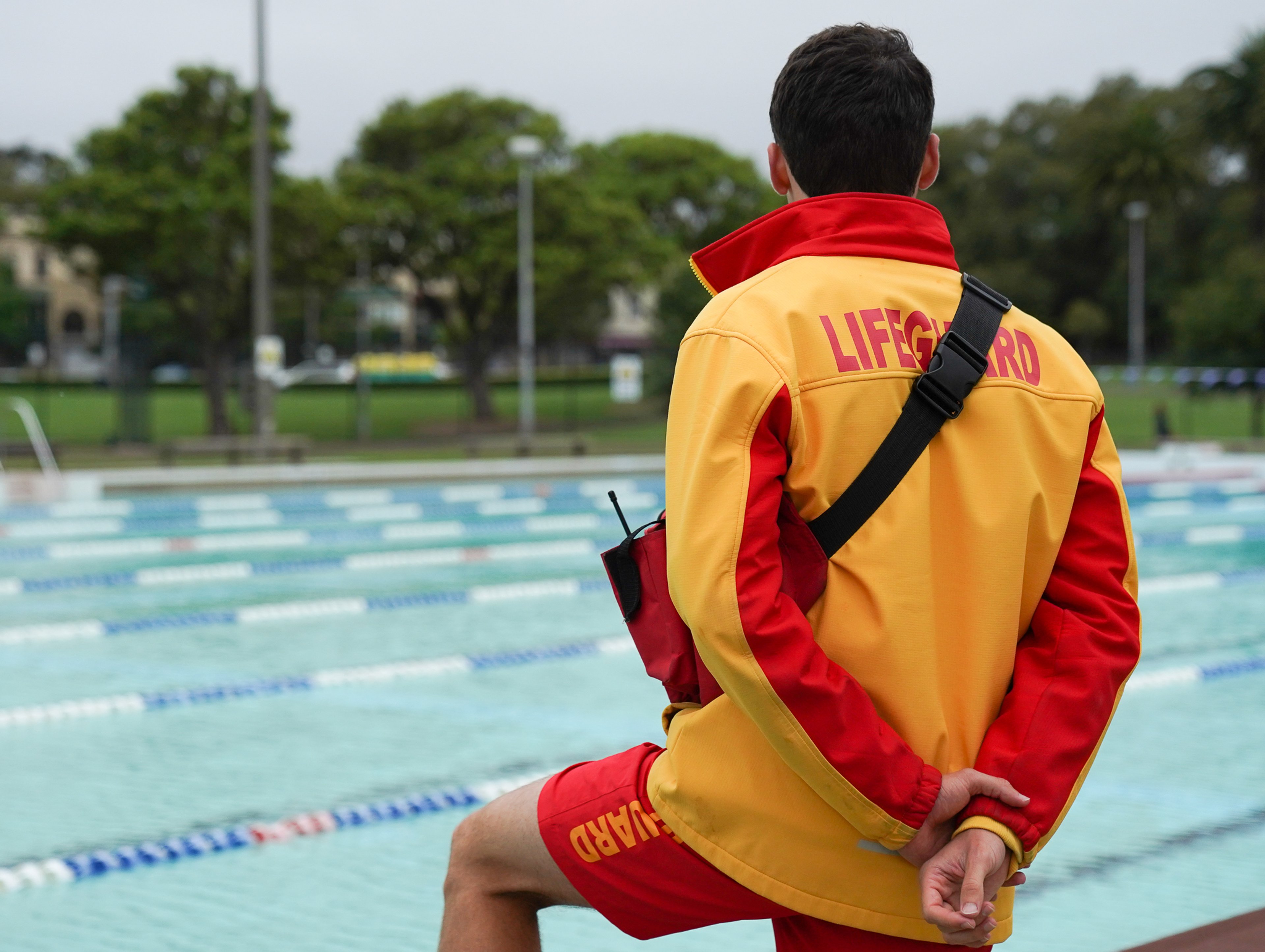 A lifeguard looking over the pool at Victoria Park Pool