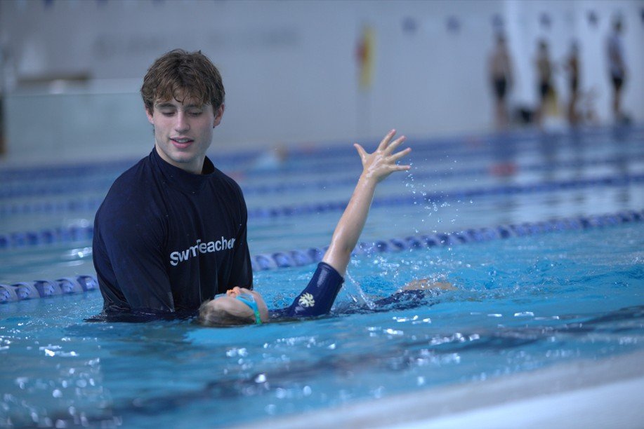 Swim teacher instructing a child during a swim lesson at Ian Thorpe Aquatic Centre