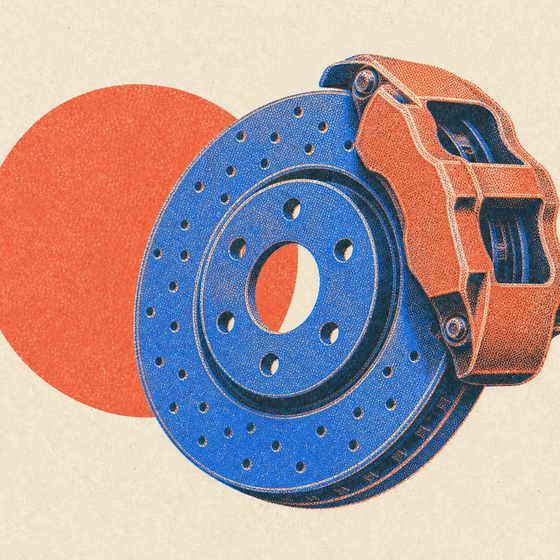 A printed cross-drilled brake disc with a caliper clamped over its edge