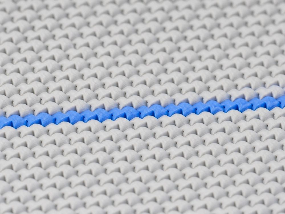 Macro view of a fine matte weatherproof printed skin with a single cobalt course running through it