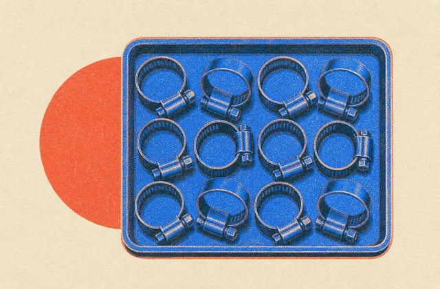 A build plate seen from above, tiled with a dozen identical printed hose clips