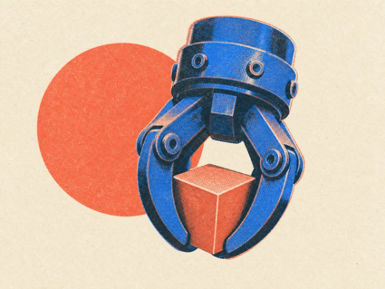 A printed three-fingered robotic gripper closed around a small cube
