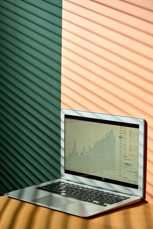Laptop on desk showing data and business tools