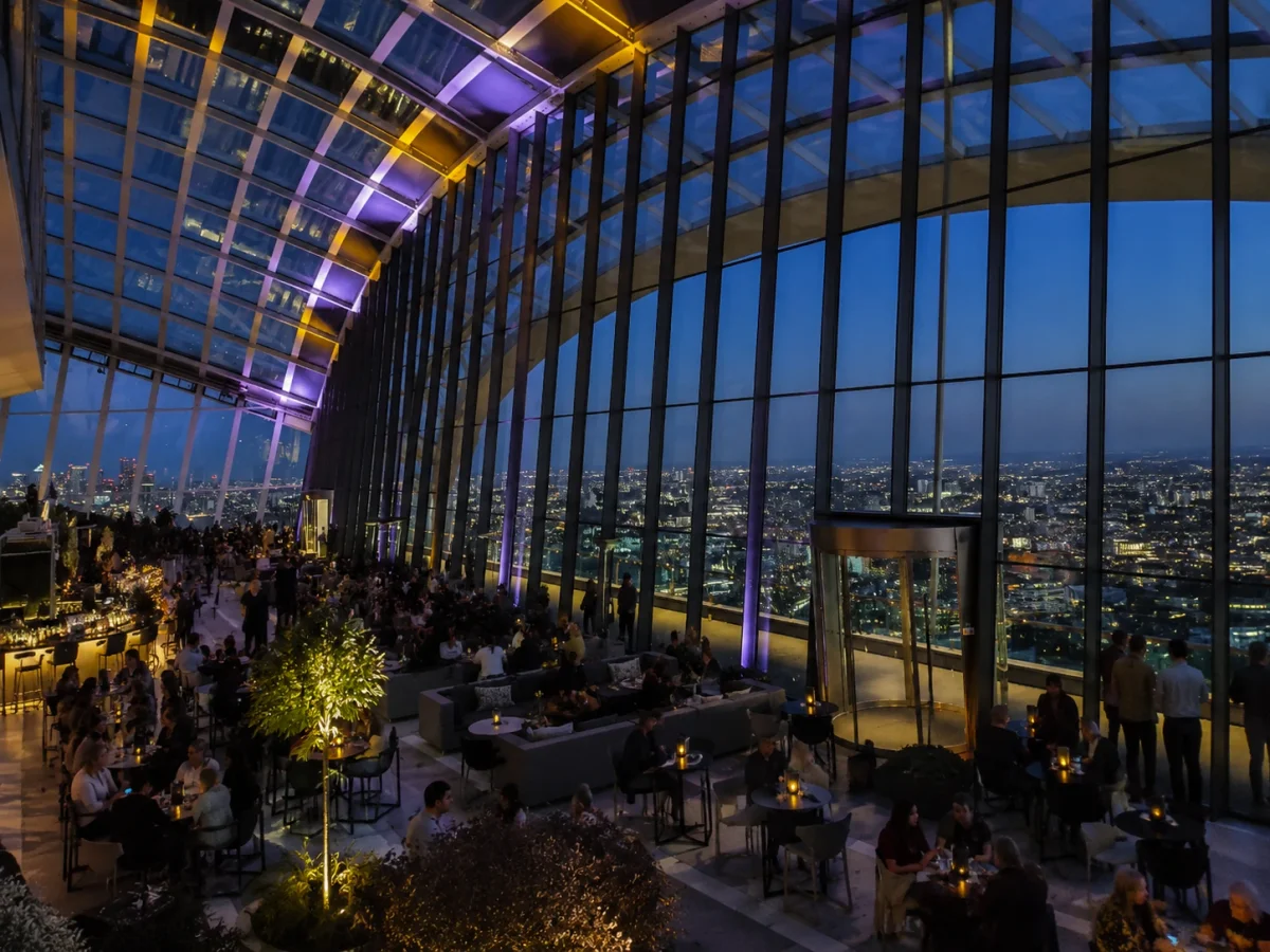 Skyline dining room with evening city views for an occasion-led birthday near Spitalfields | Partyfer