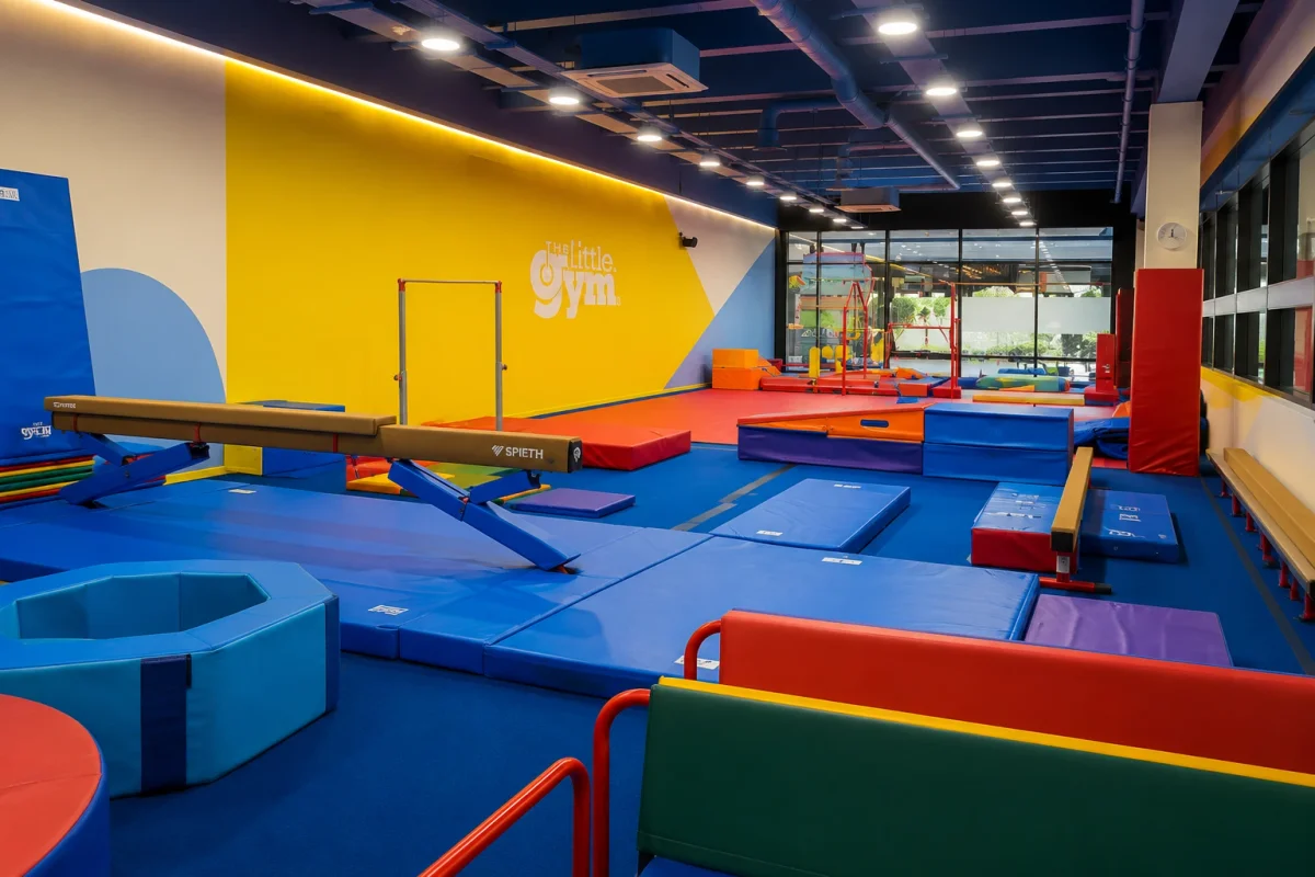 High-energy indoor activity venue with gymnastics mats, beams and movement zones | Partyfer