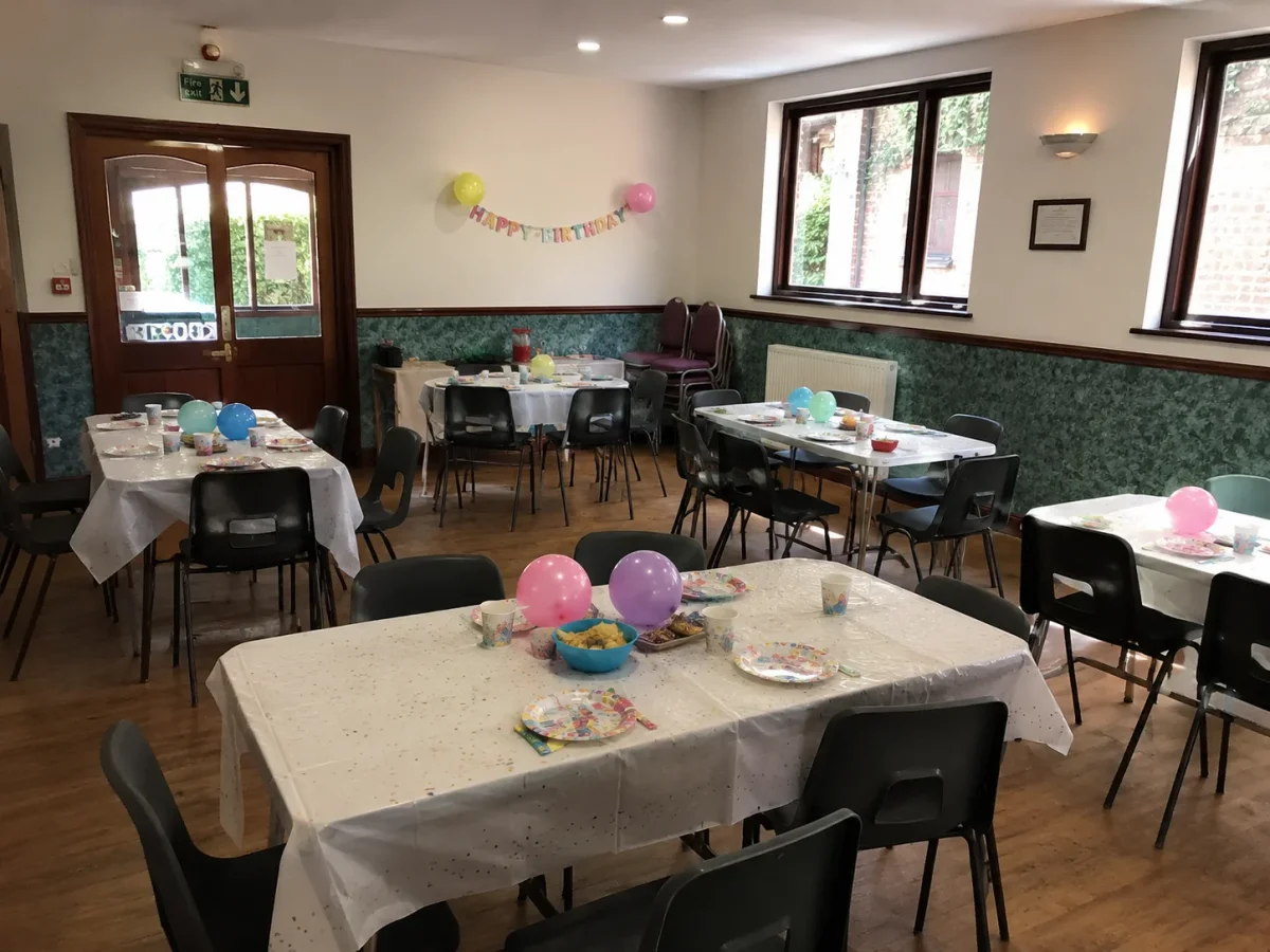 Small local hall near Beckenham with simple birthday tables, balloons and family party setup | Partyfer