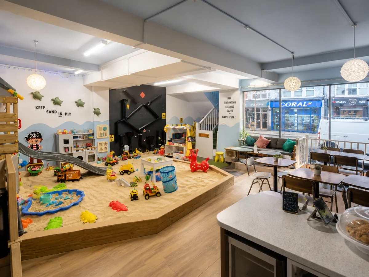 Sensory and exploratory play café setting for a calm 1st birthday celebration | Partyfer