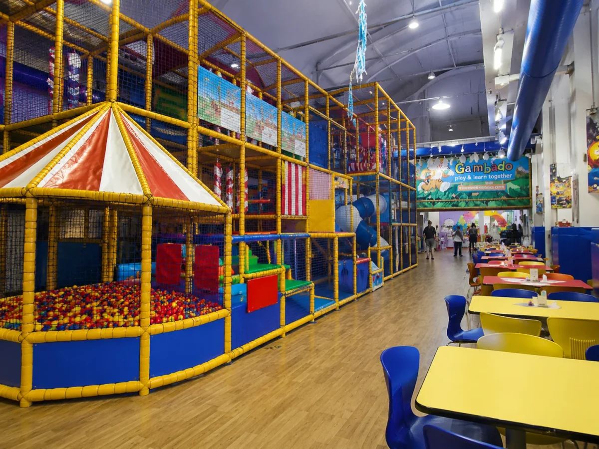 Multi-level soft play maze with party tables at Gambado | Partyfer