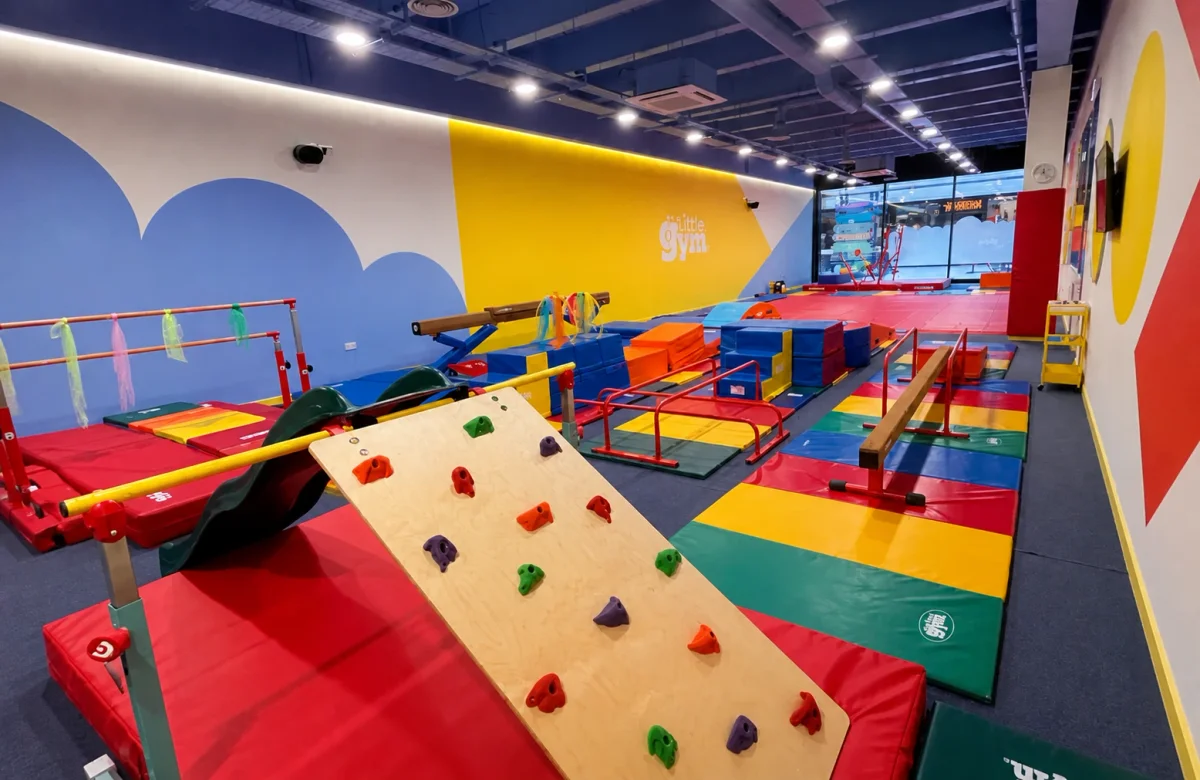 Active girls birthday venue at The Little Gym with colourful equipment and open play space | Partyfer