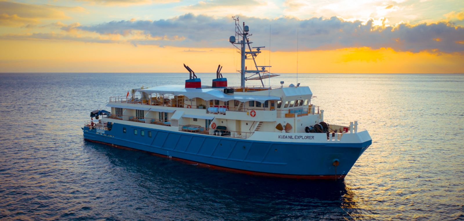 Kudanil Explorer at anchor in eastern Indonesia at sunrise.